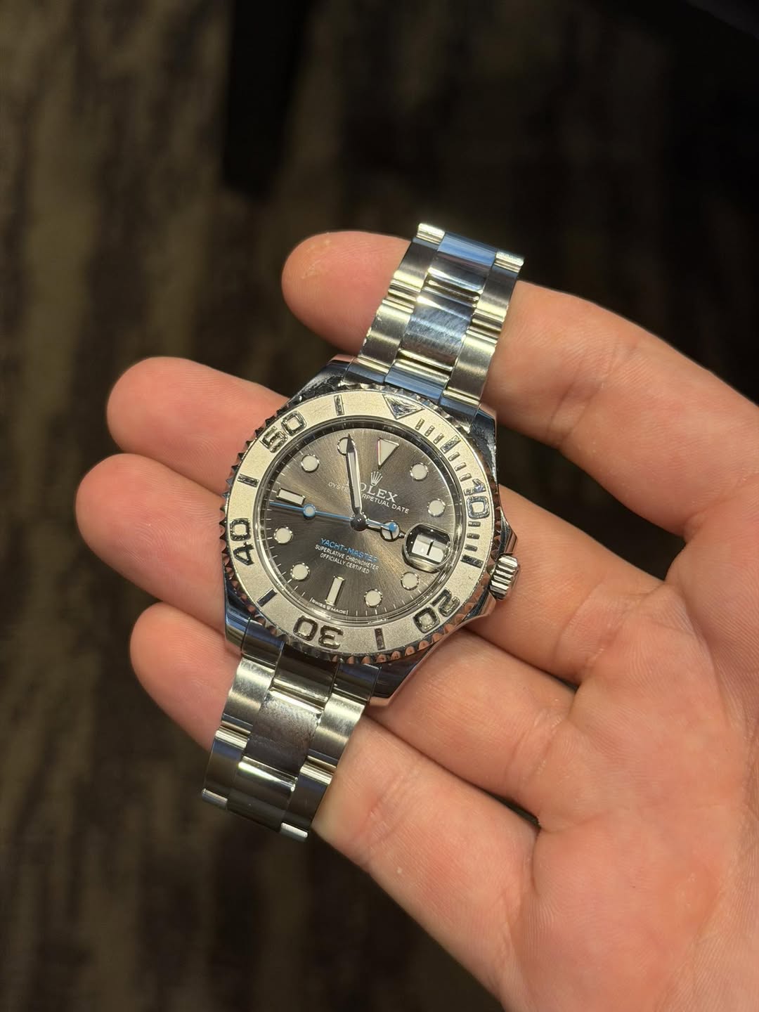 May be an image of wrist watch and text