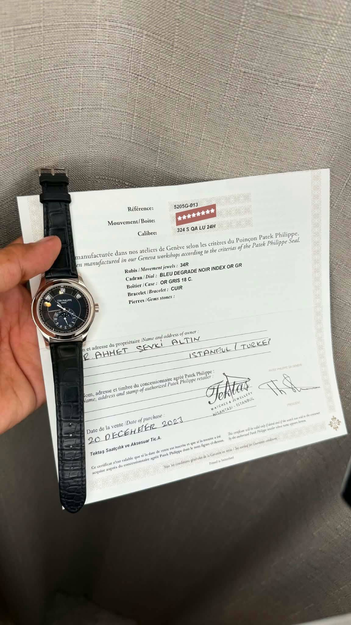 May be an image of digital watch, ticket stub and text