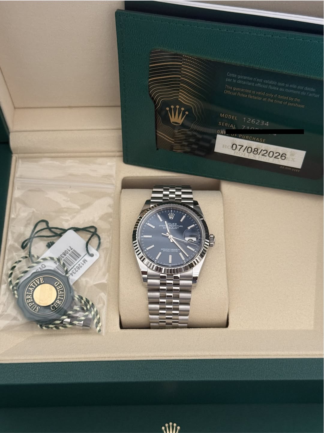 May be an image of wrist watch and text