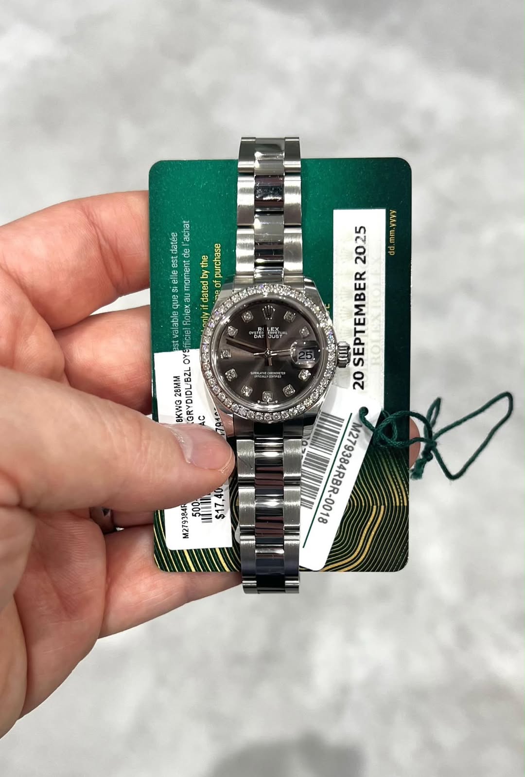 May be an image of wrist watch and text
