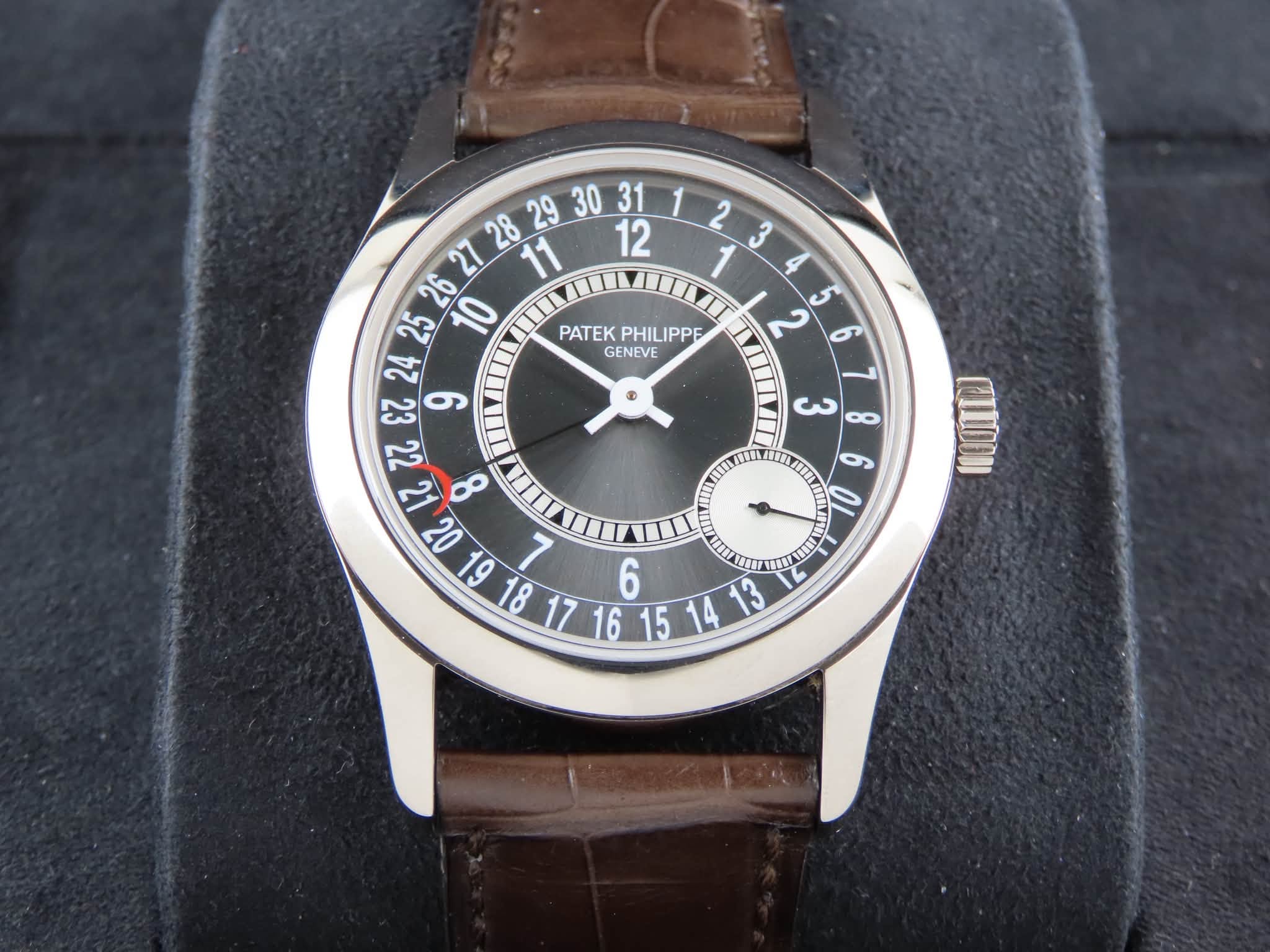 May be an image of wrist watch and text that says ' PATEK PHILIPPE PATEKPHILIPPE IPPE GENEVE ي 14 20 6 L 6 ف 1413 V حن DO LIVI IIIN 10 6'