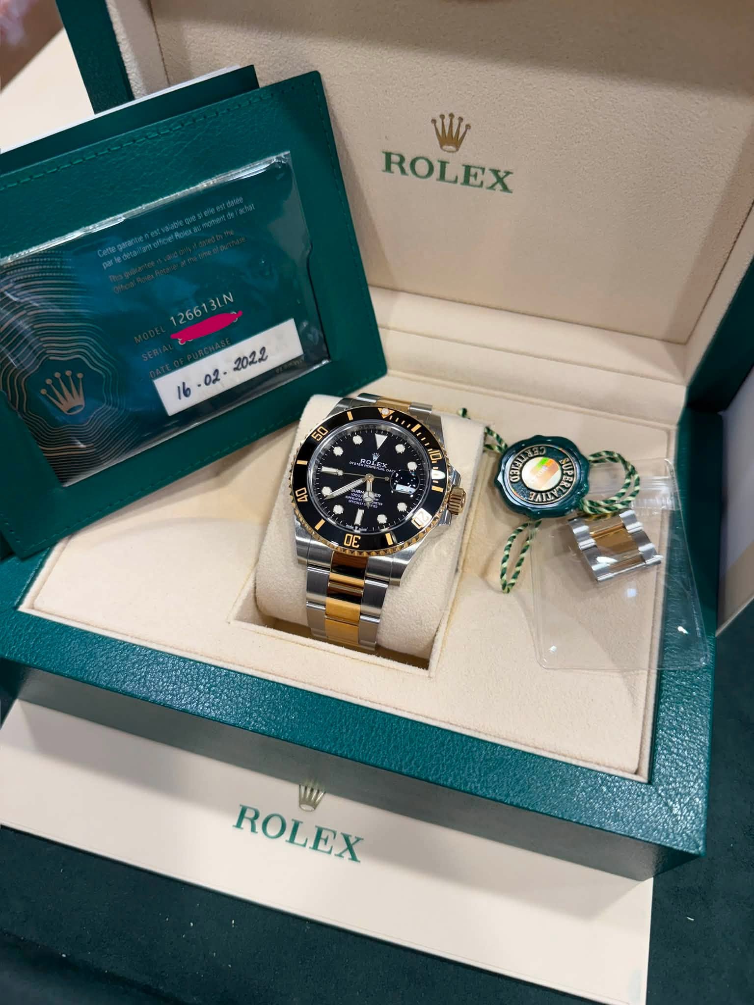 May be an image of wrist watch and text that says 'W ROLEX 126613LN 126613LN 3LN 담 ORC E Ban 無 5 3 0E DE ROLEX'