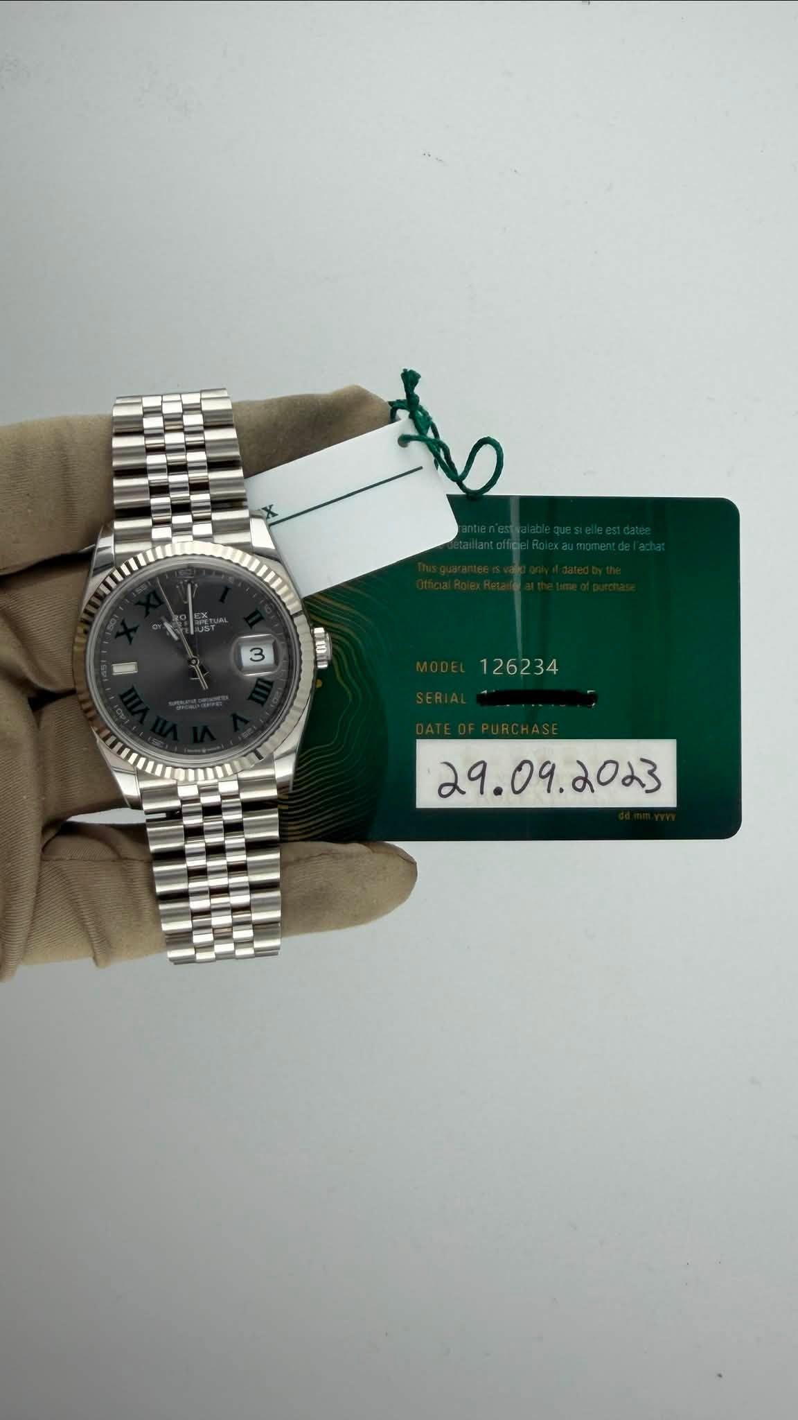 May be an image of wrist watch and text