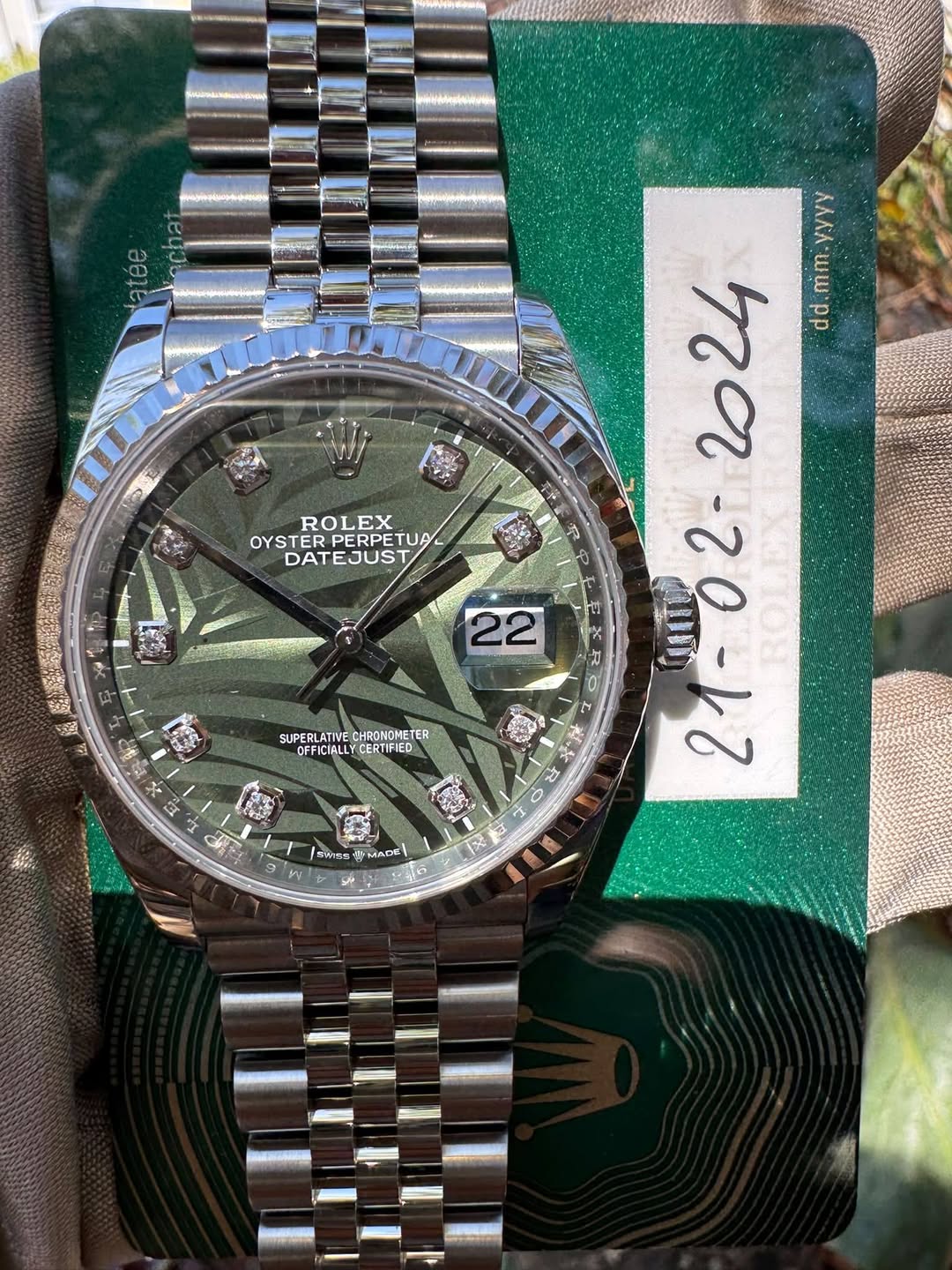 May be an image of wrist watch and text
