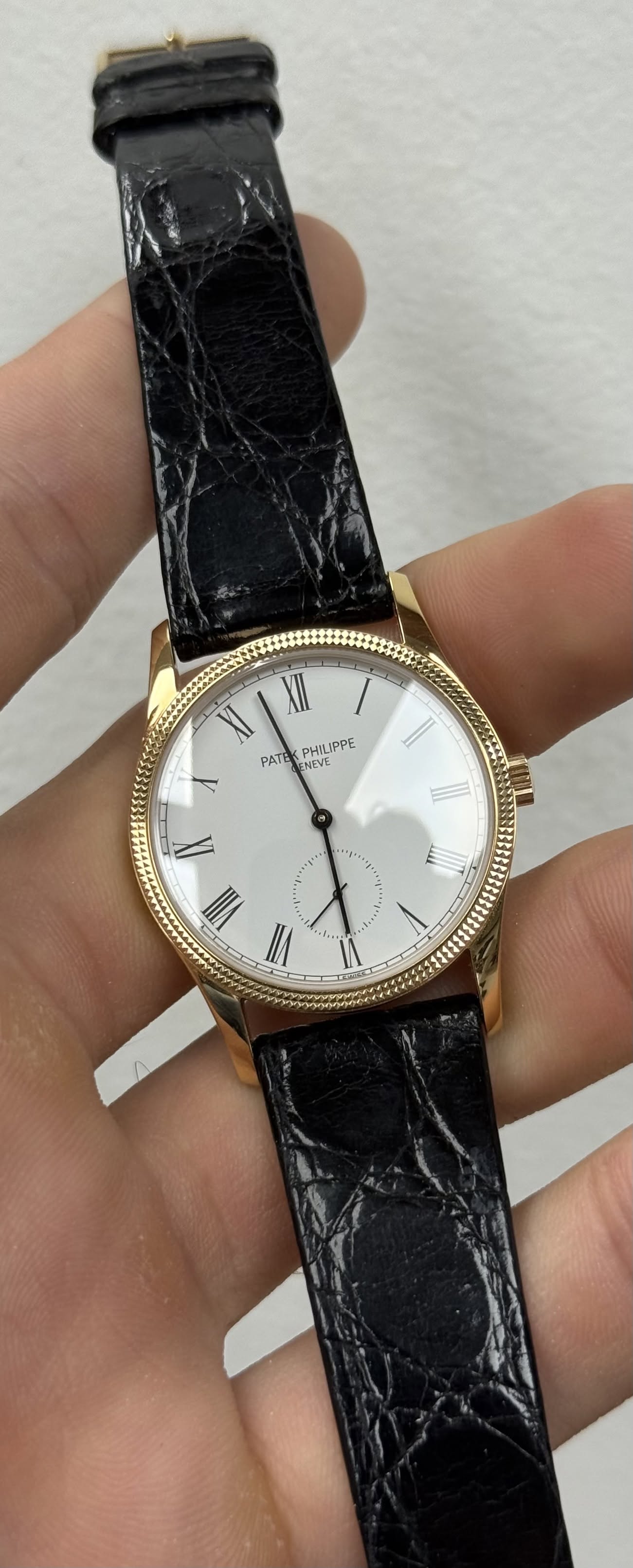 May be an image of wrist watch and text