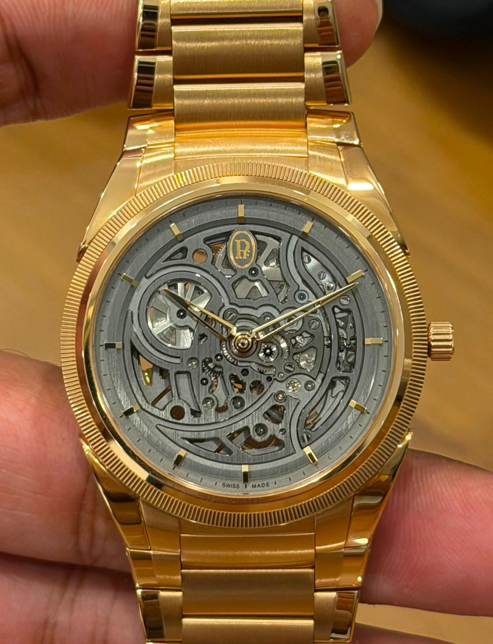 May be an image of wrist watch and text