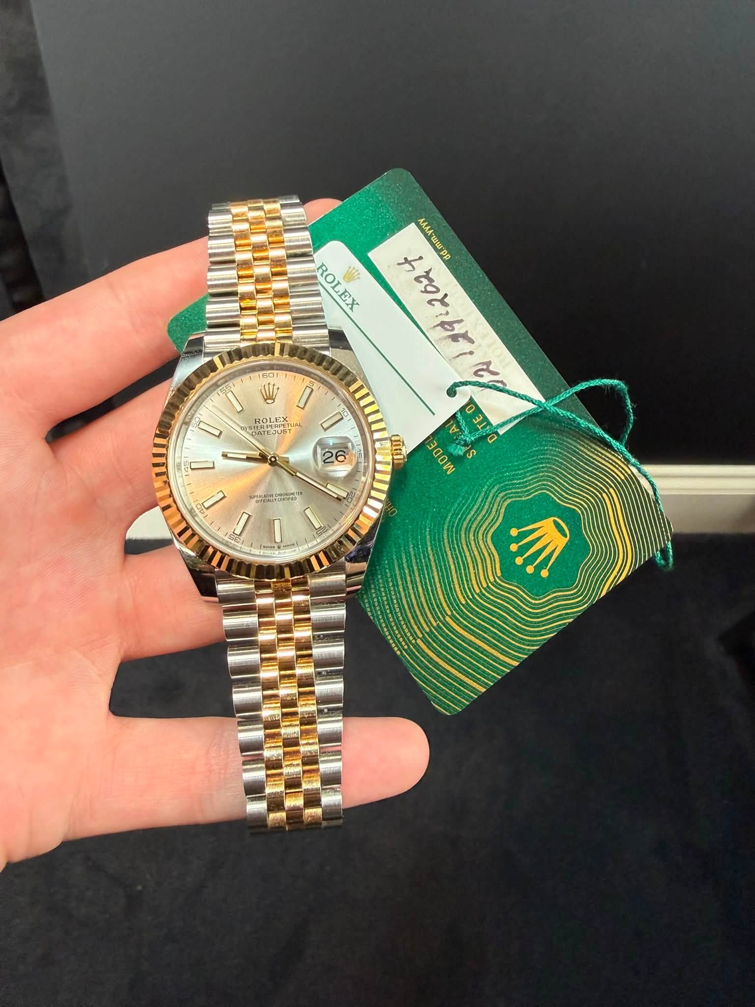 May be an image of wrist watch and text
