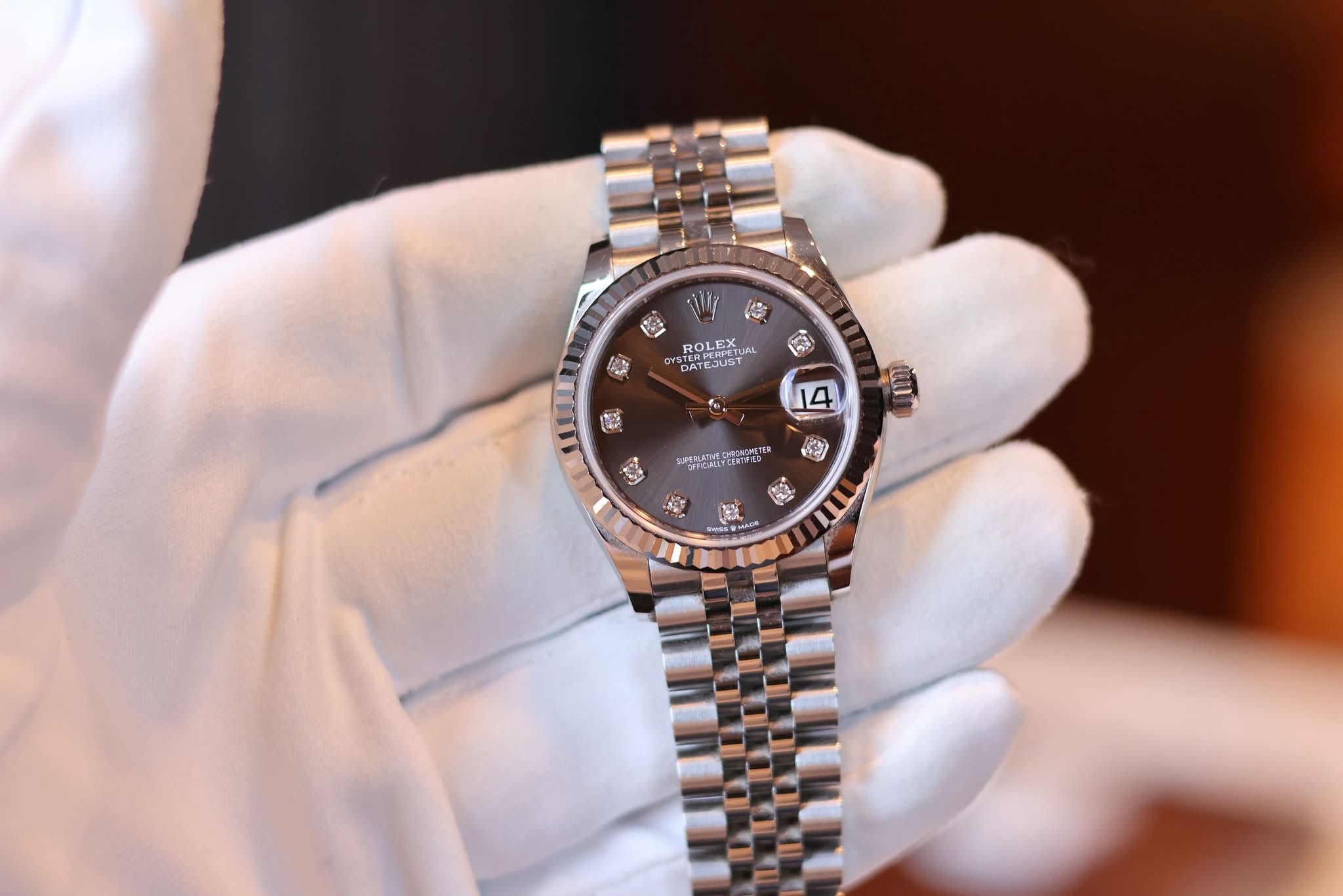 May be an image of wrist watch and text