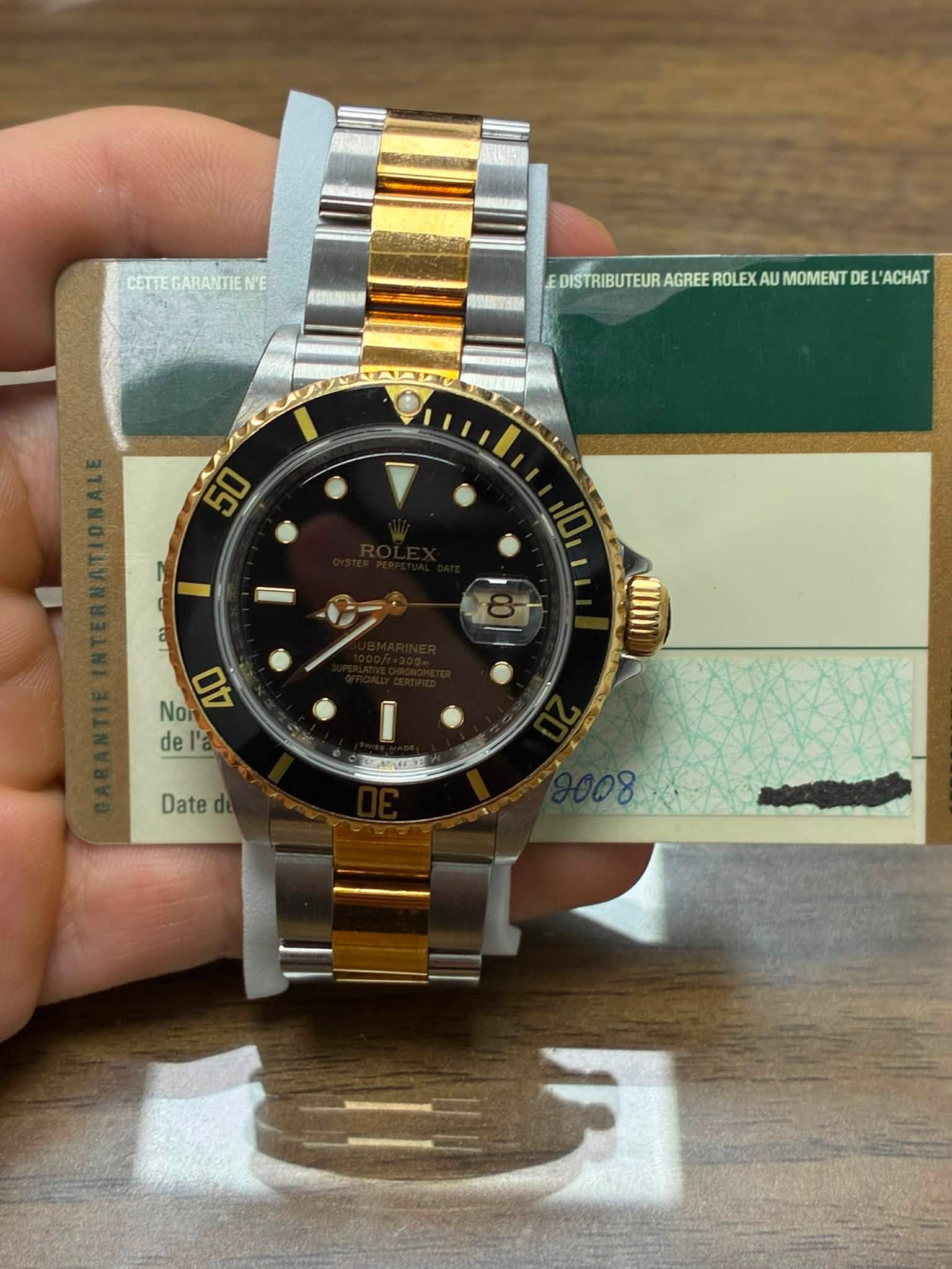 May be an image of wrist watch and text