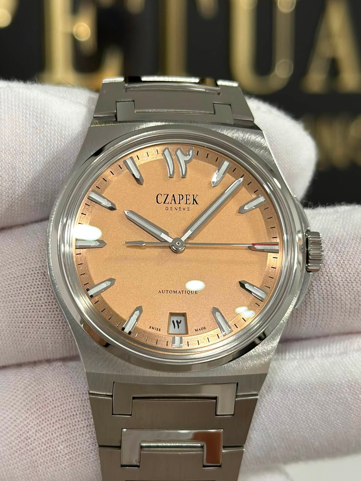 May be an image of wrist watch and text that says 'T ۱٢ CZAPEK GENEVE Junco ۱ا AUTOM TIQUE AUTOMATIQUE SWTAS ۱٢ MADE 1...'
