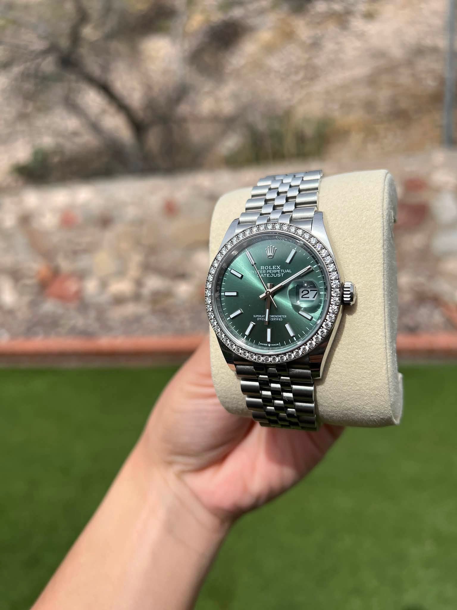 May be an image of wrist watch and text that says 'الله ROLEX FUAL RUS JUS I 27 an প KCo'