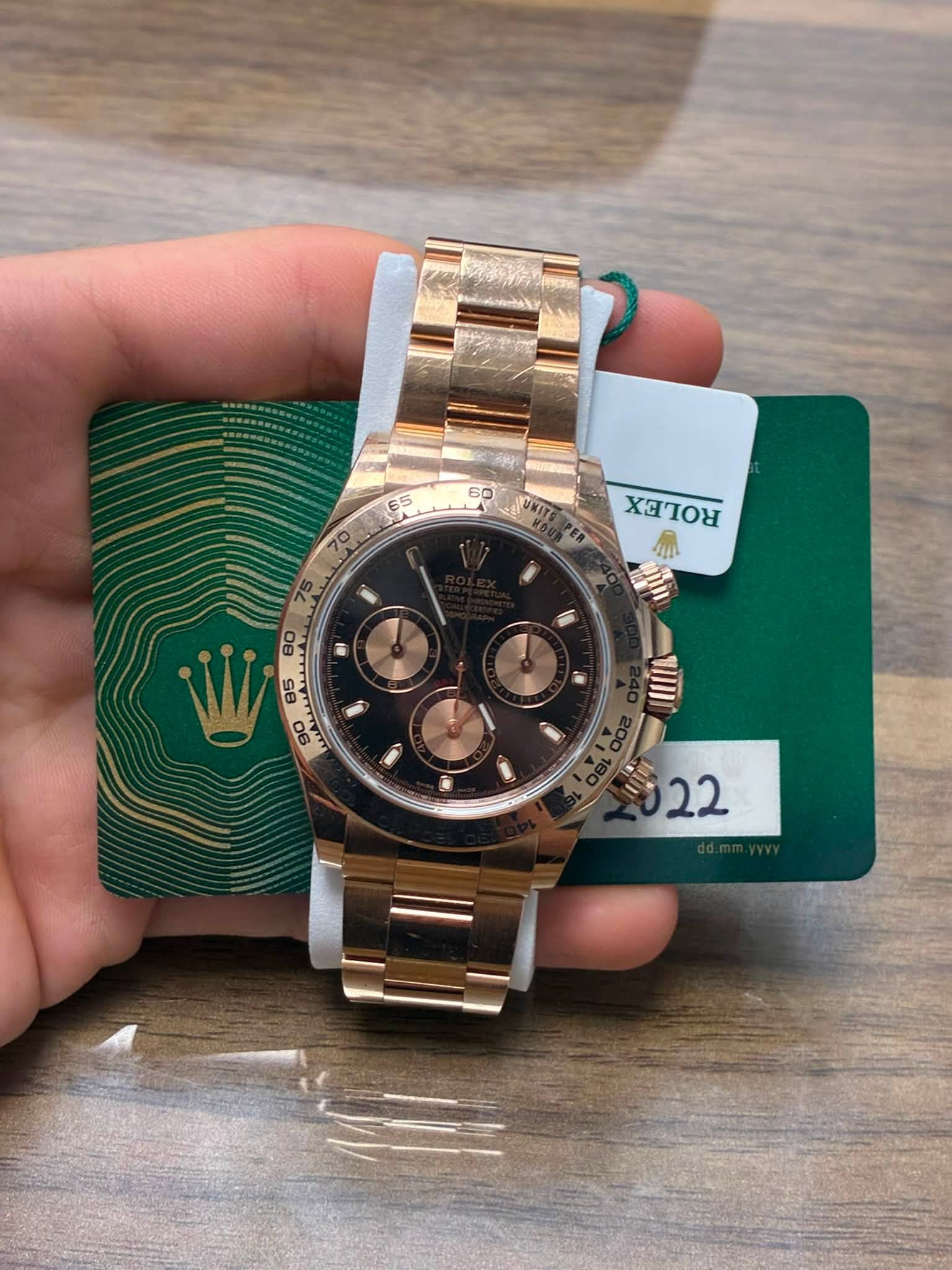 May be an image of wrist watch and text