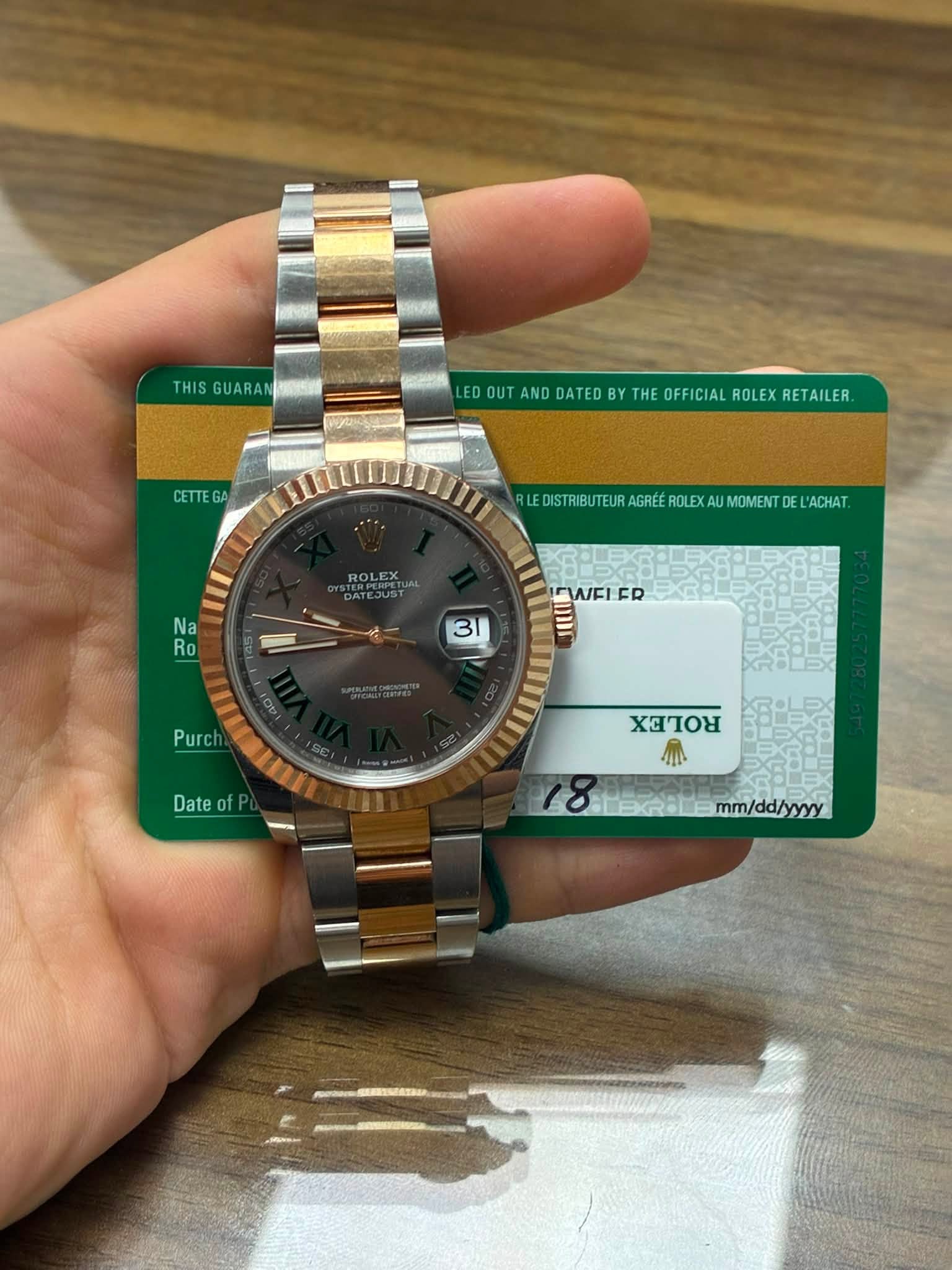 May be an image of wrist watch and text