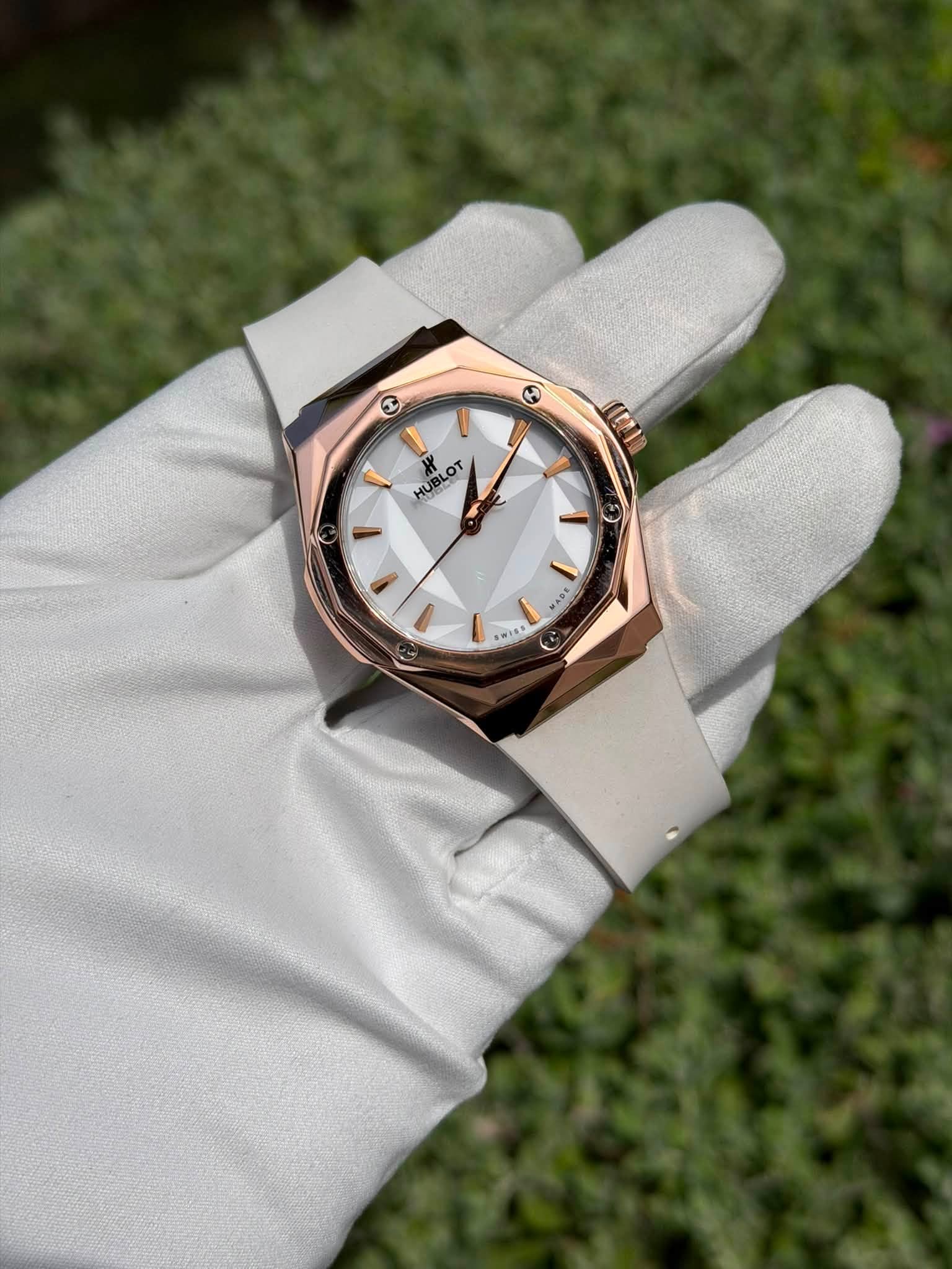 May be an image of wrist watch and text
