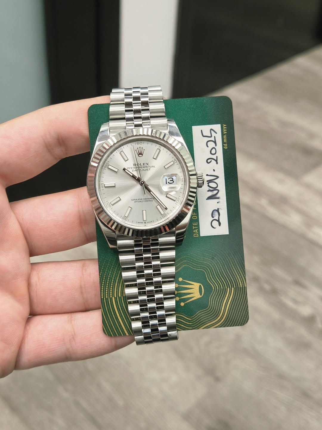 May be an image of wrist watch and text