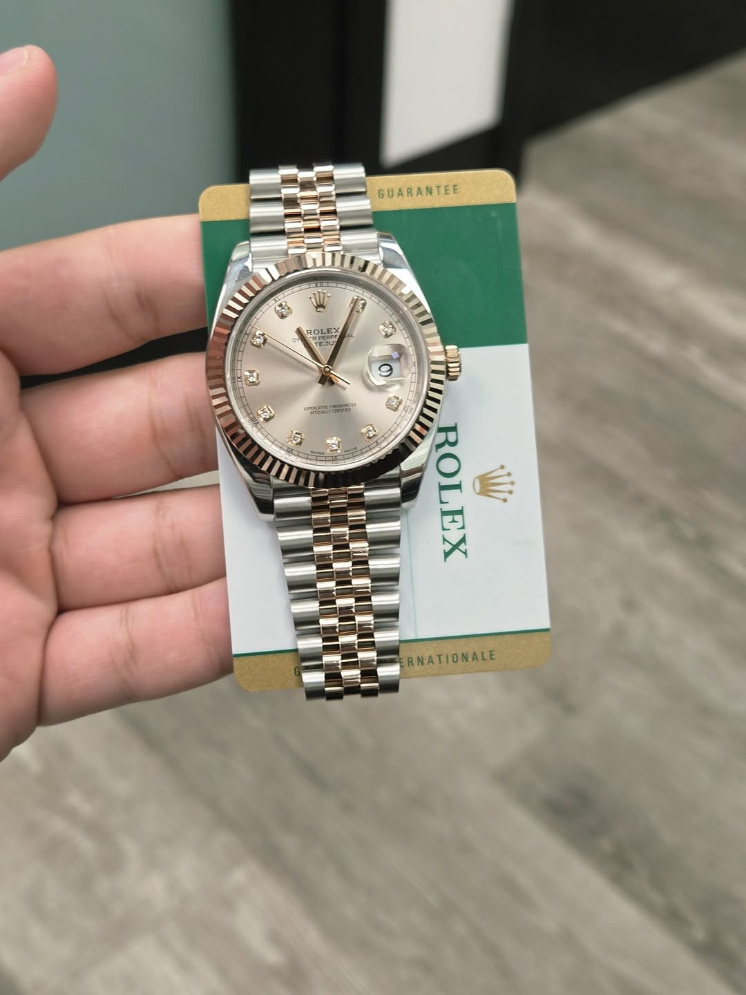 May be an image of wrist watch and text