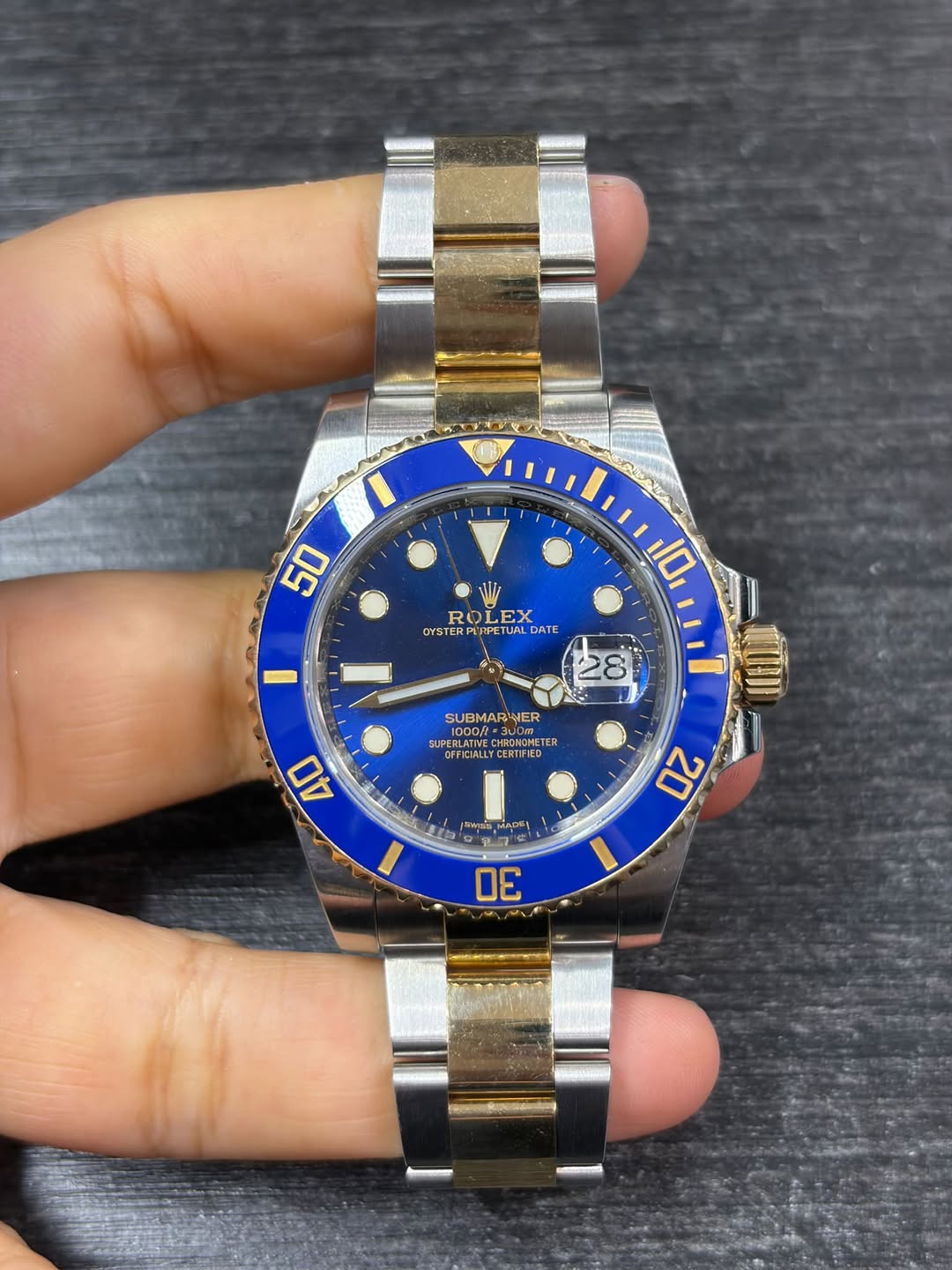 May be an image of wrist watch and text
