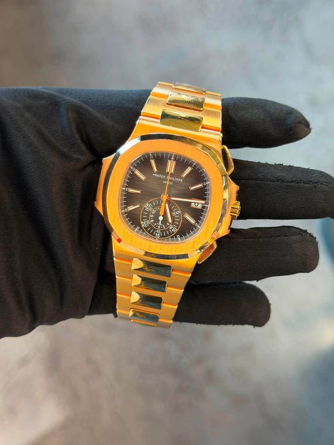 May be an image of wrist watch and text that says '*PATEK HILIPPE O ወድድን 11 0 5 | 88 5 - 1 PO 10 احا 15 aluna'