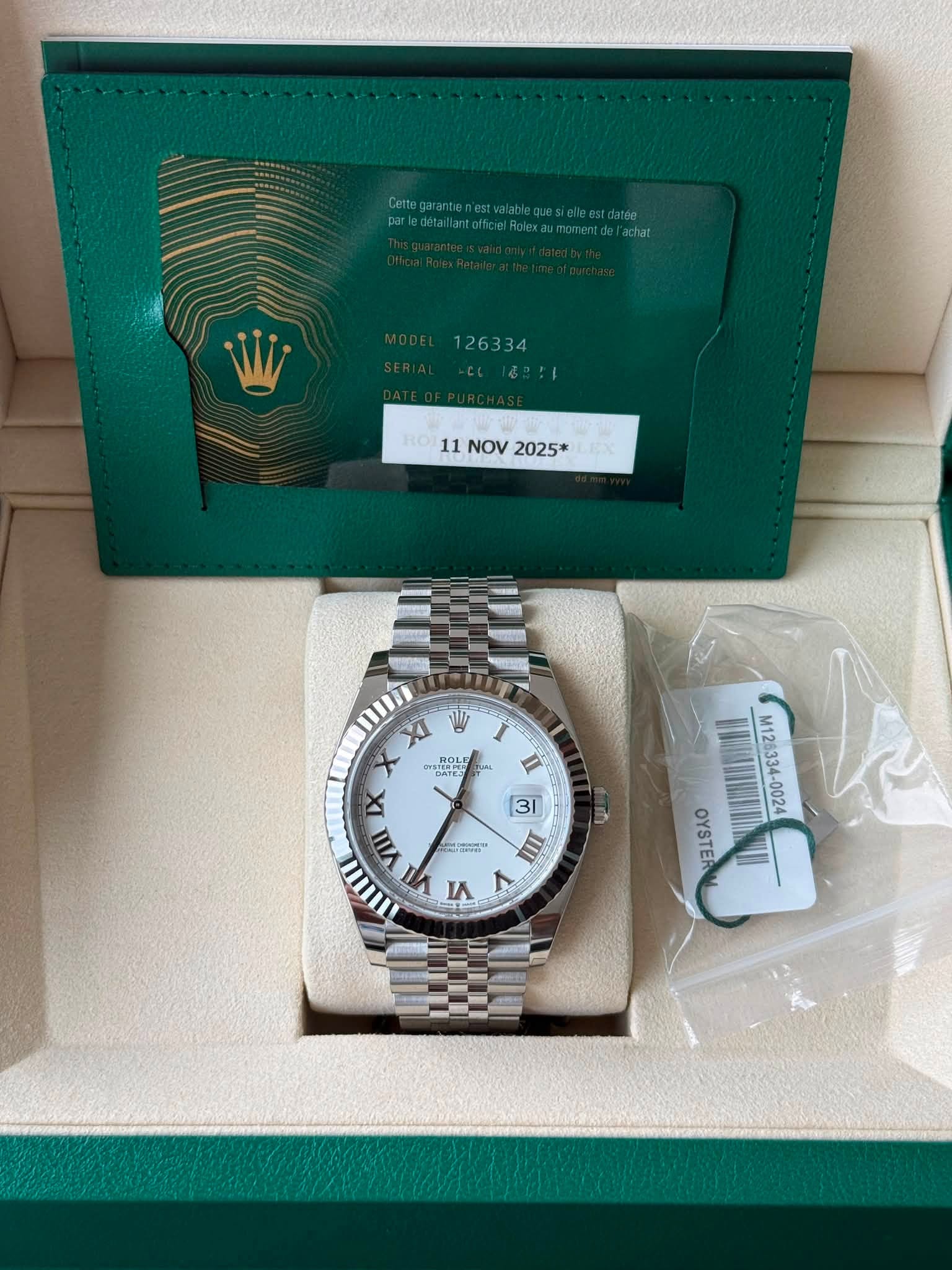 May be an image of wrist watch and text that says ' ROT 11NOV2025* 11 NOV 2025* XI X SERPER 月O DATES SHOLE ุ 4 X 3/ 3 VIII 7 4 L 2ao" III M12 M126334 -0024 OYSTER'
