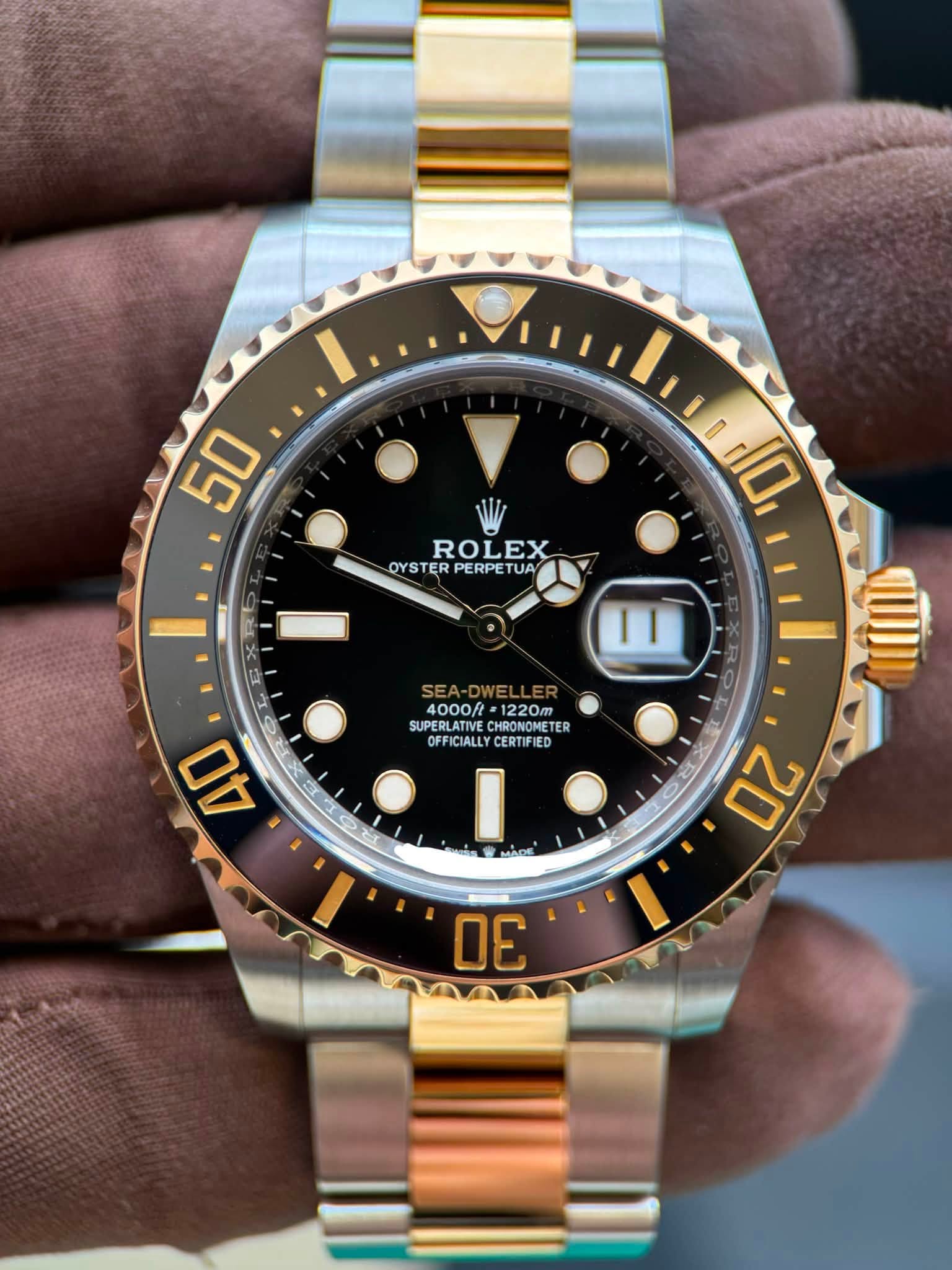 May be an image of wrist watch and text that says '50 ROLEX OYSTERPERPETUA OYS OYSTER PERPE UA م lid0, ,10 । ١١ 4000/ 1220m SUPERLATIVE CHRONOMETER OFFICIALLY ICIALLY CERTIFIED…