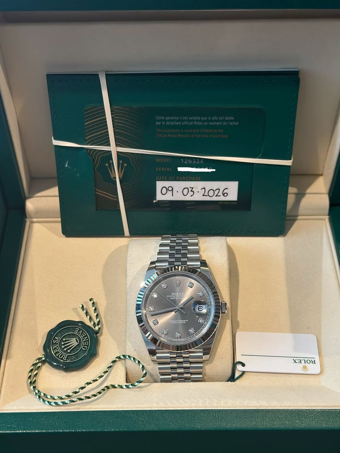 May be an image of wrist watch and text