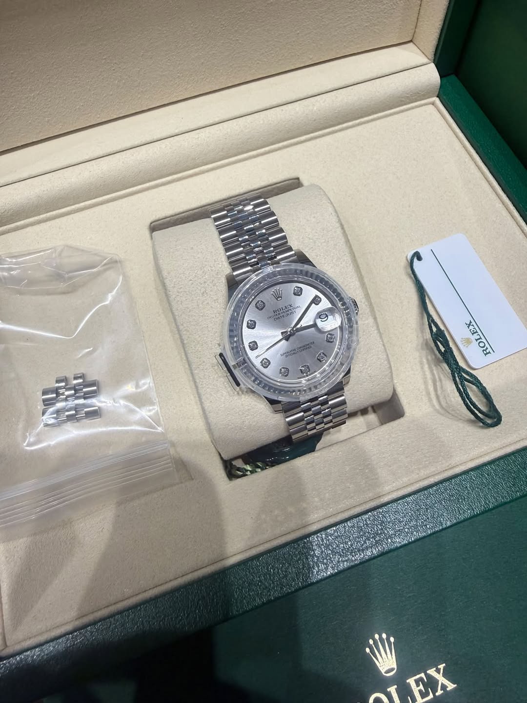 May be an image of wrist watch and text