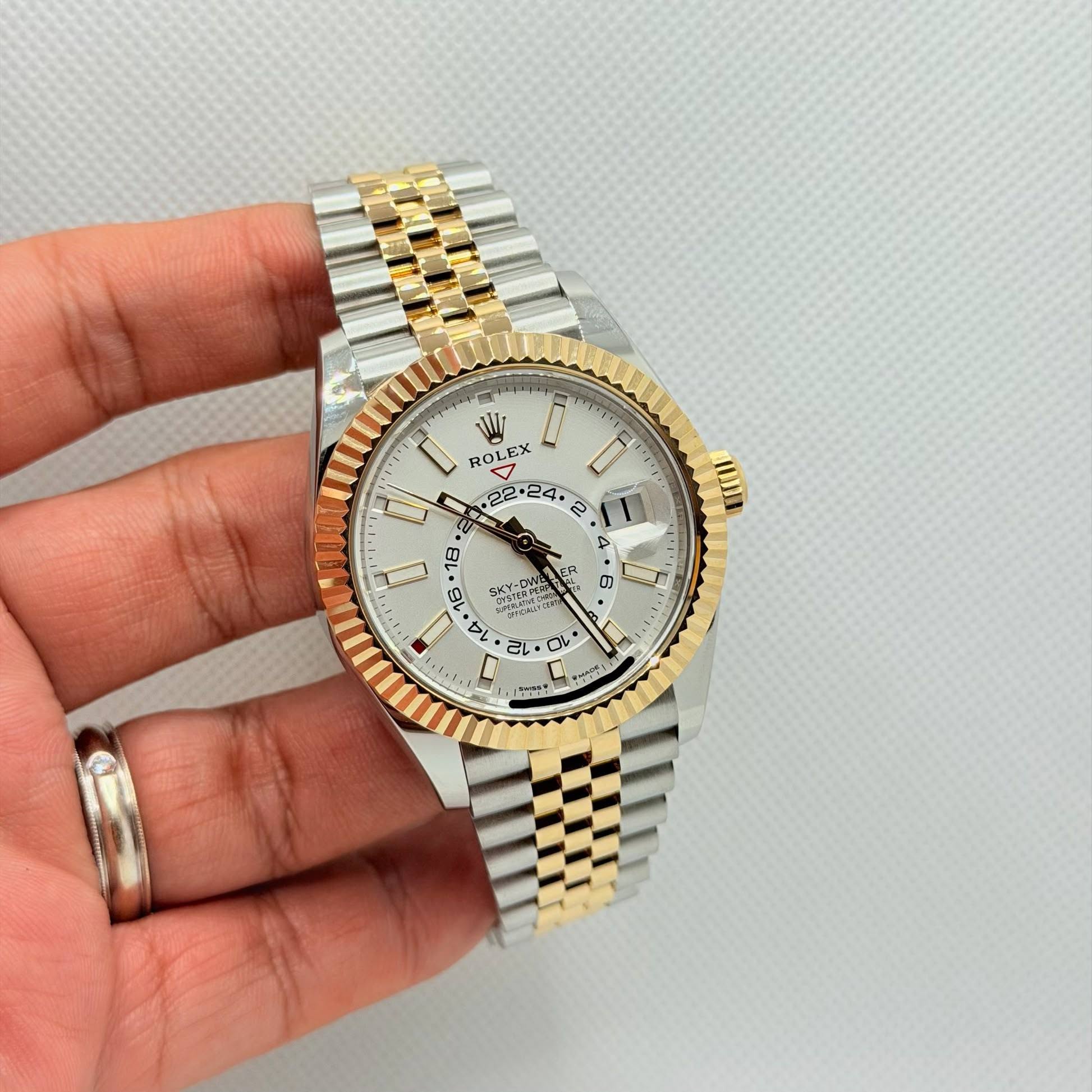May be an image of wrist watch and text