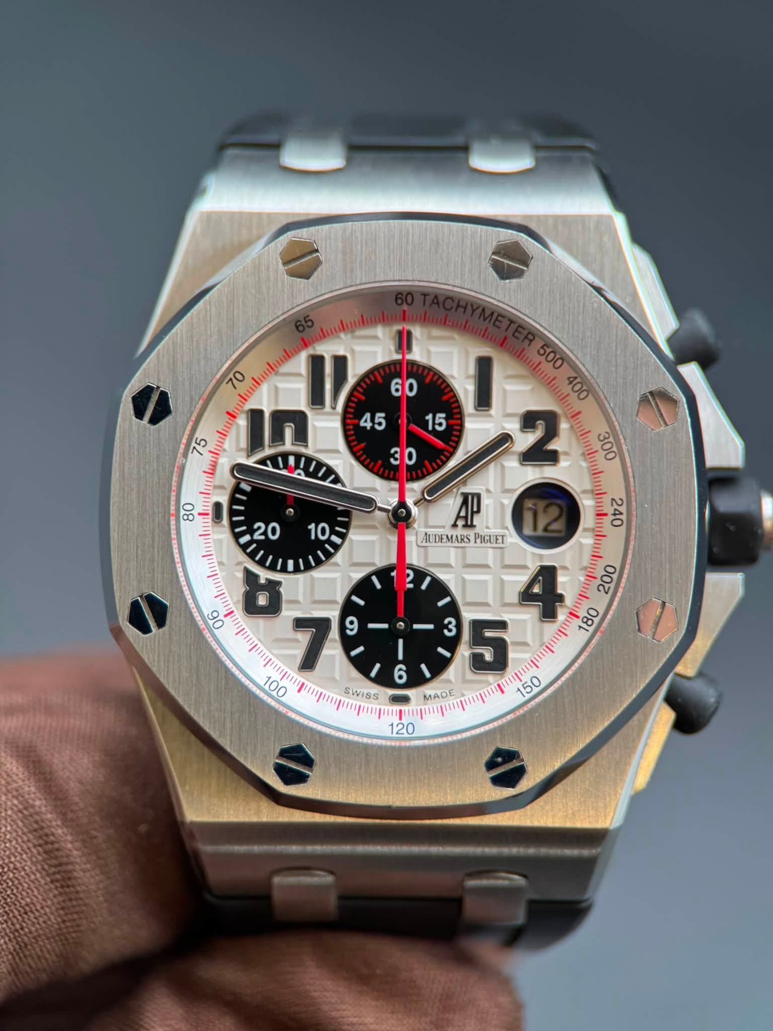 May be an image of wrist watch and text