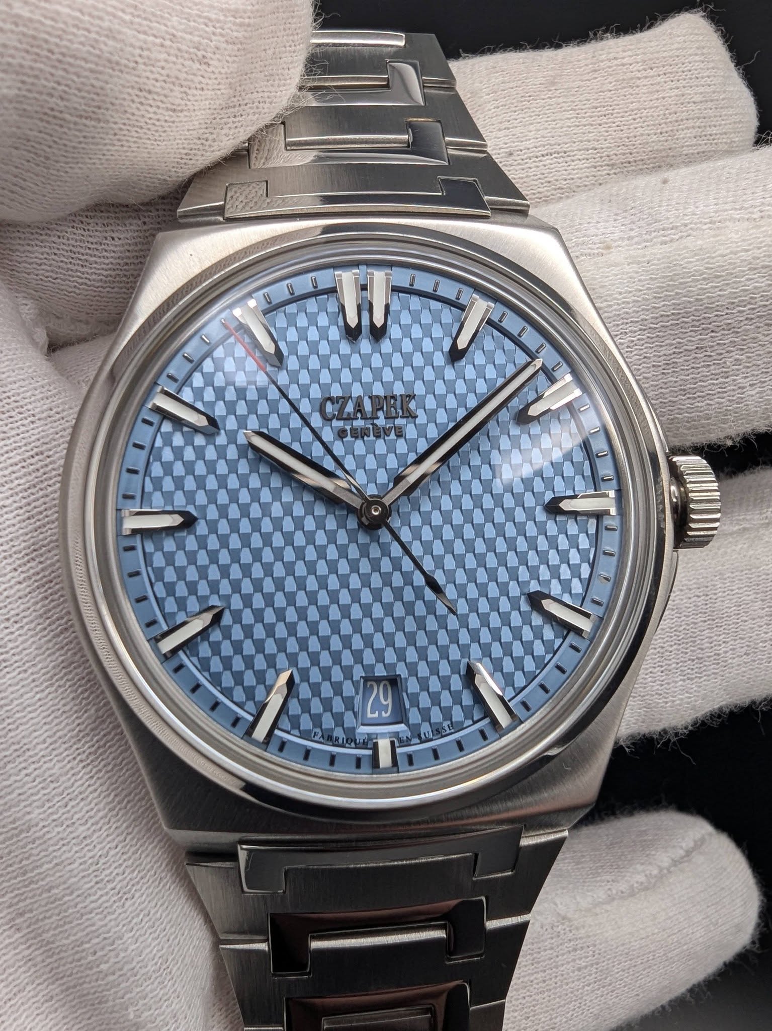 May be an image of wrist watch and text