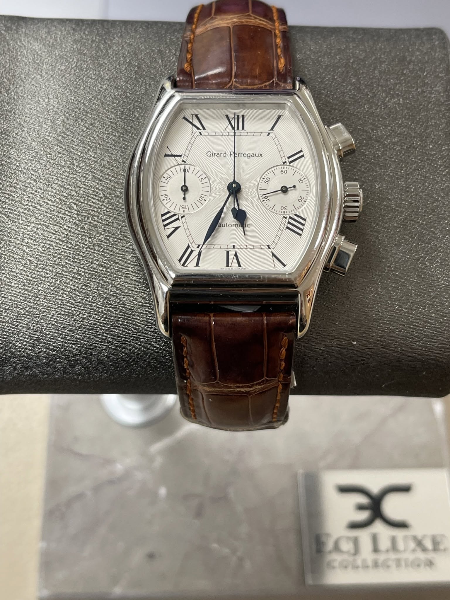 May be an image of wrist watch and text