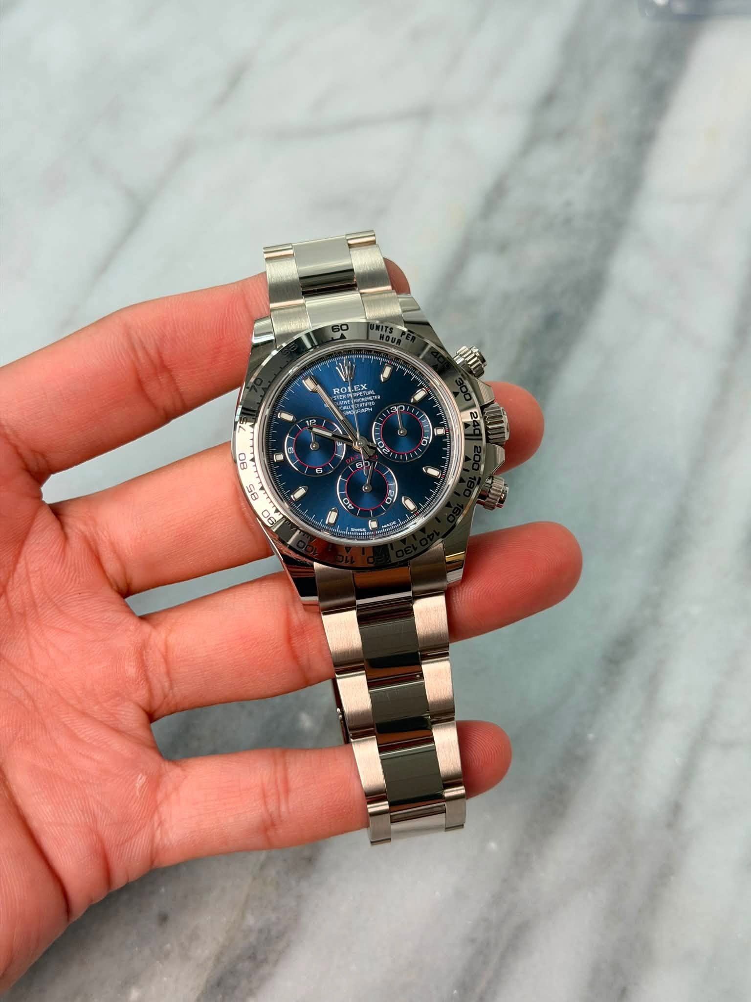 May be an image of wrist watch and text