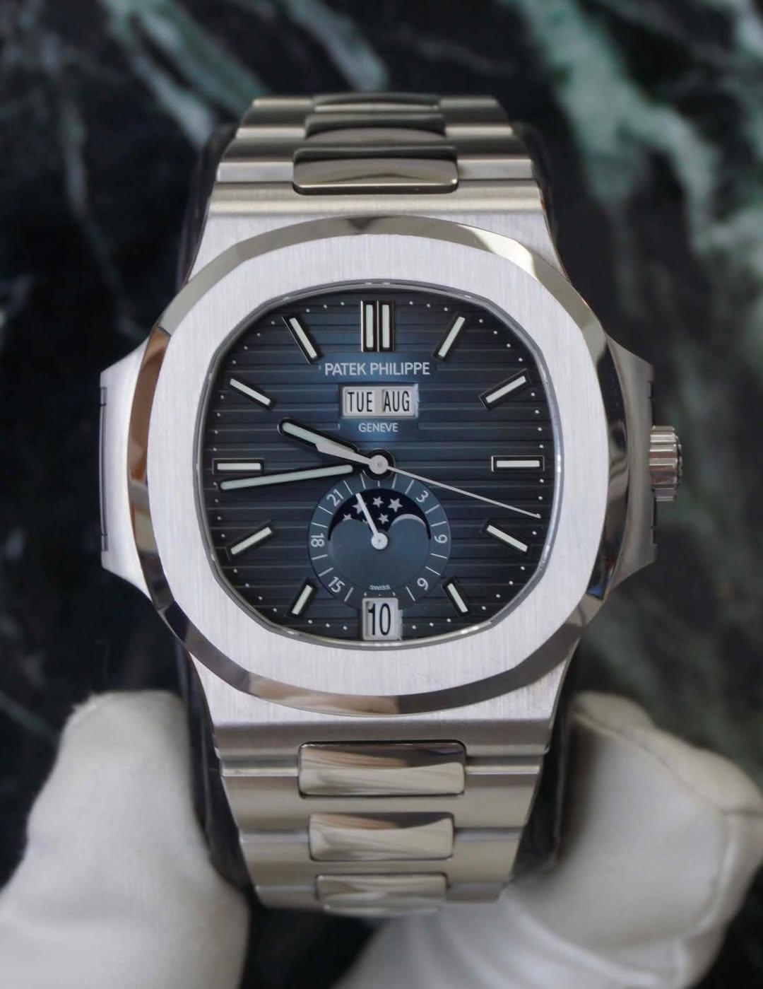May be an image of wrist watch and text that says 'PATEKPHILIPPE PATEK PHILIPPE TUEAUG TUE AUG GENEVE 2 3 कો و 15 SWISk ZWG د 10 9 /'