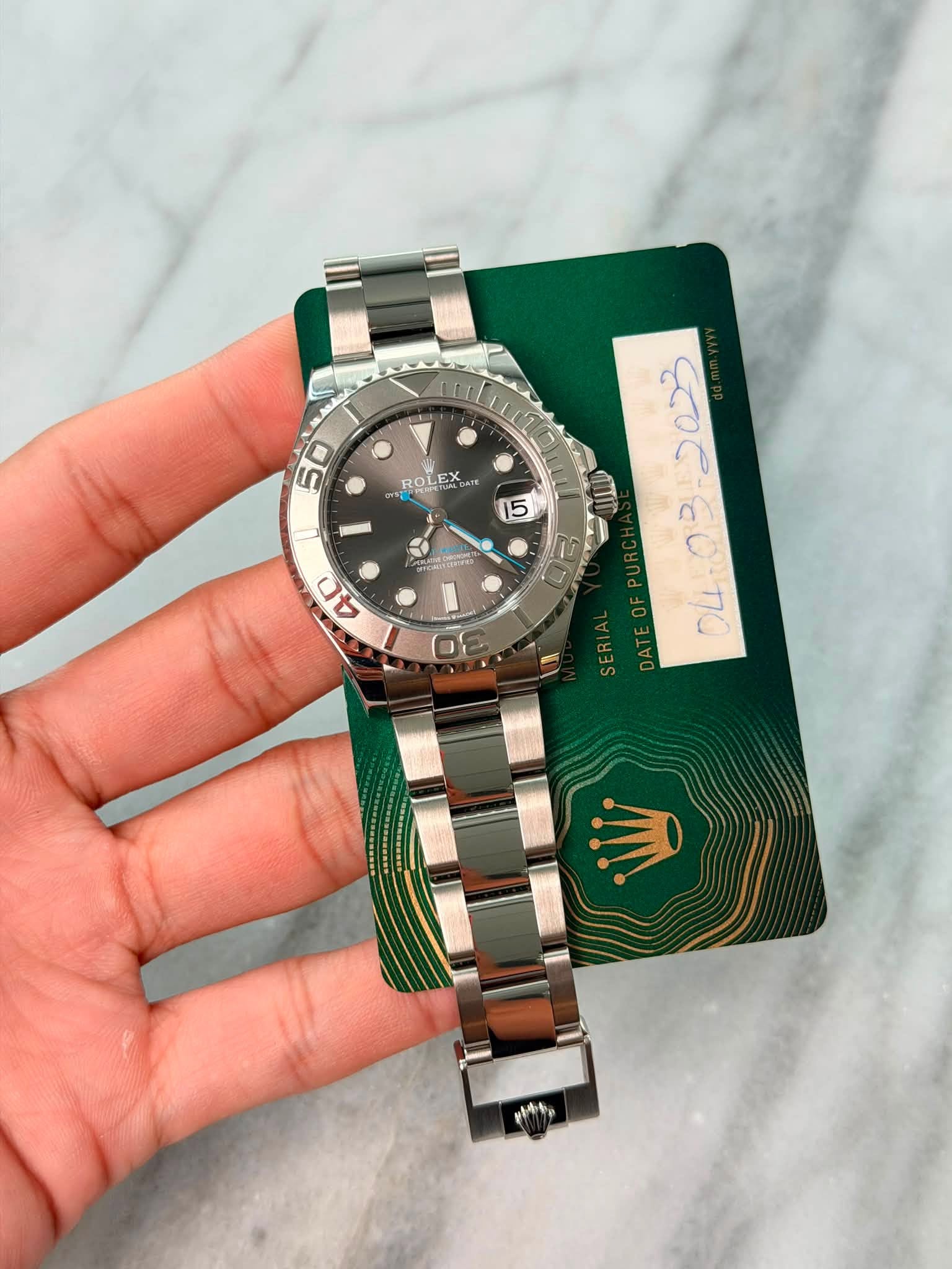 May be an image of wrist watch and text
