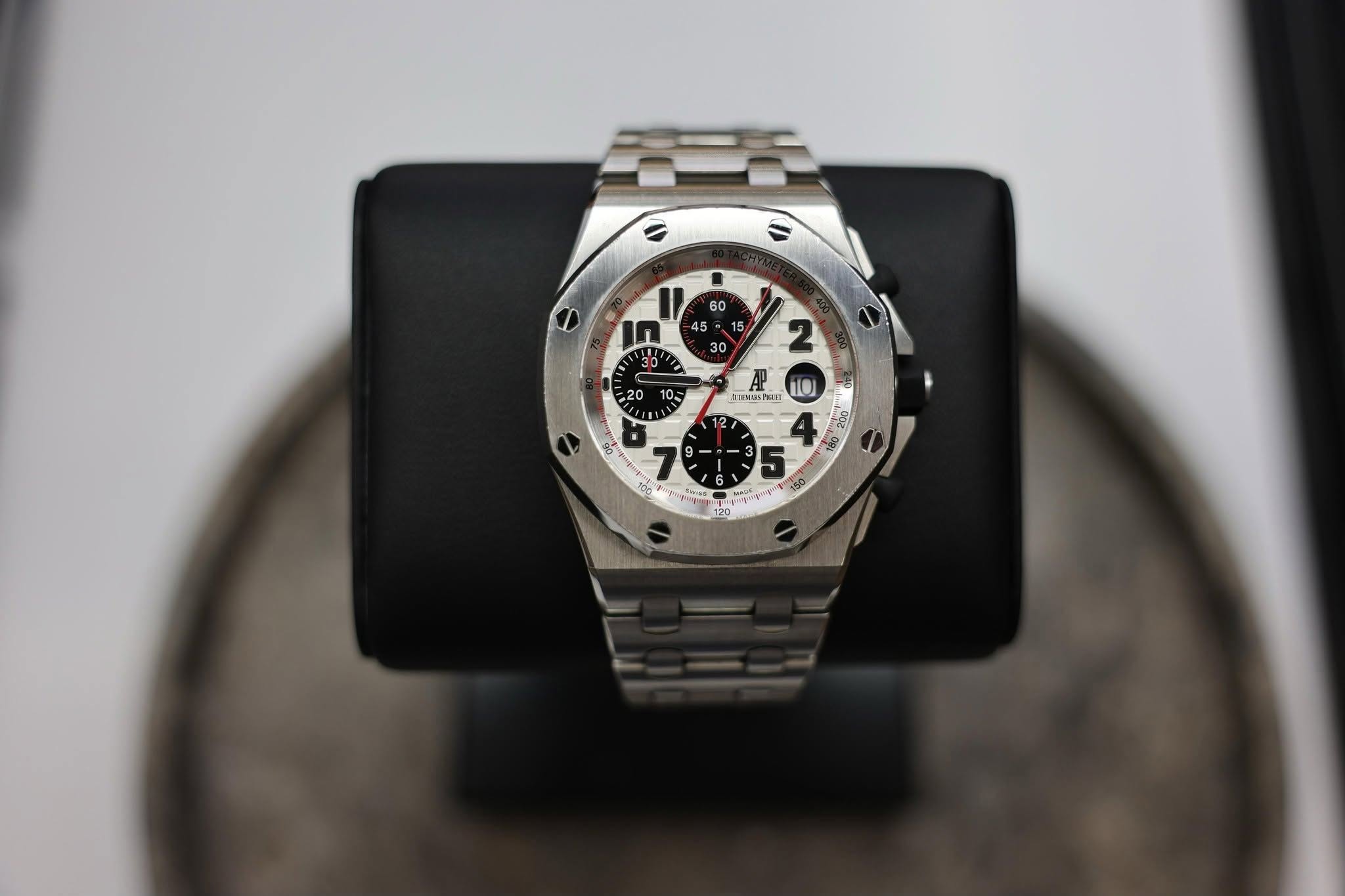 May be an image of wrist watch and text