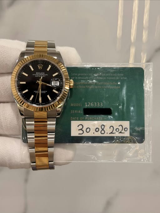 May be an image of wrist watch and text that says 'ROLEX mI1 18 KUN '