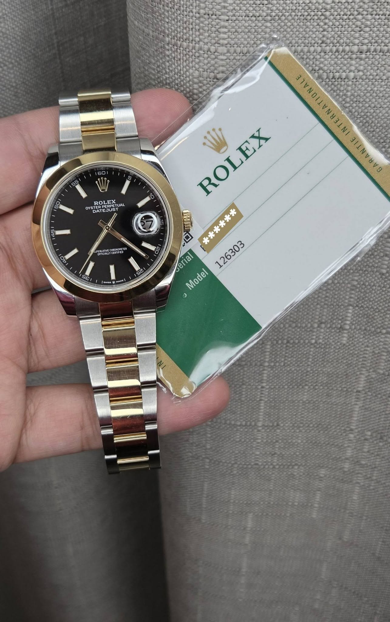 May be an image of wrist watch and text