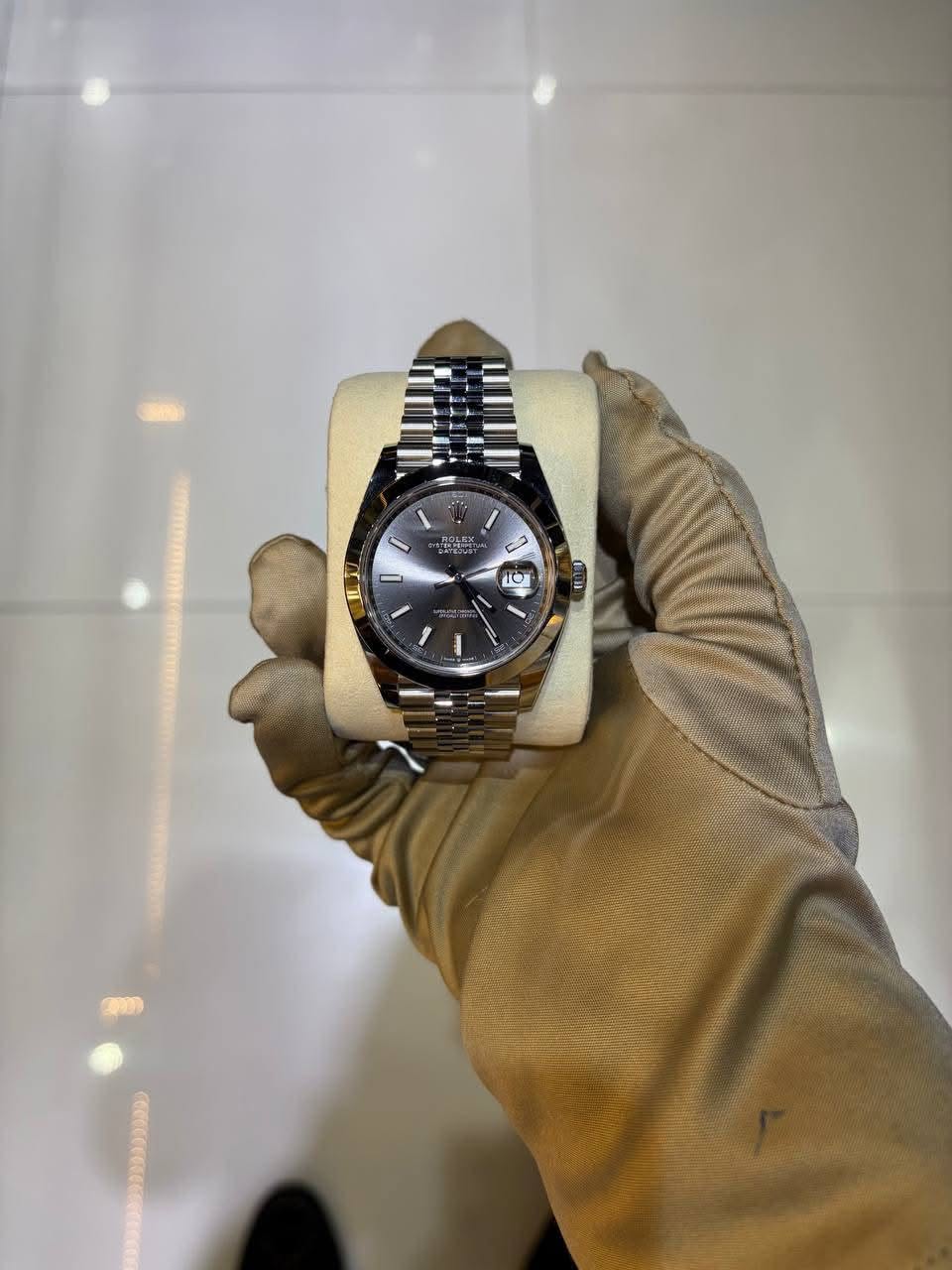 May be an image of wrist watch and text
