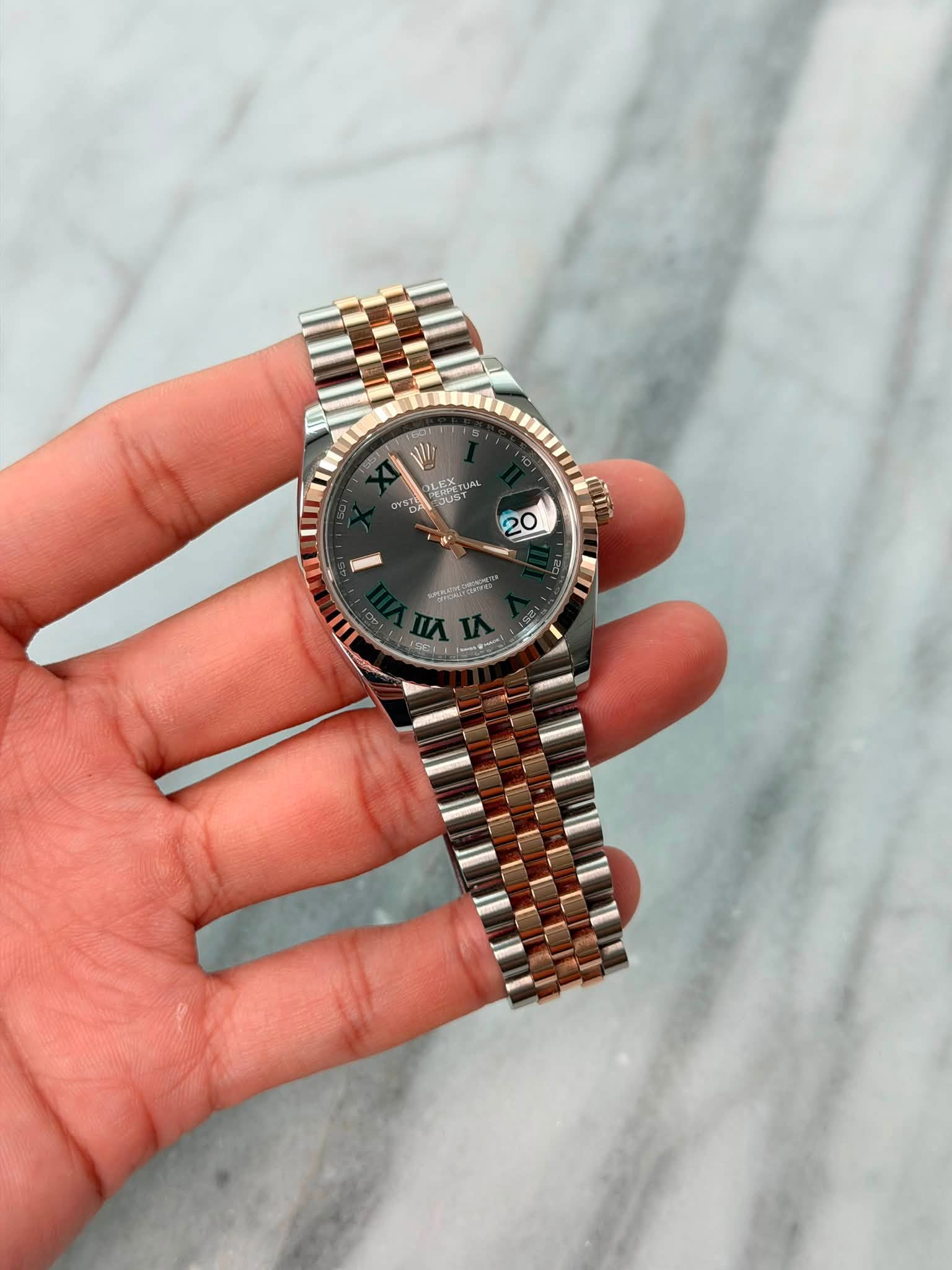 May be an image of wrist watch and text