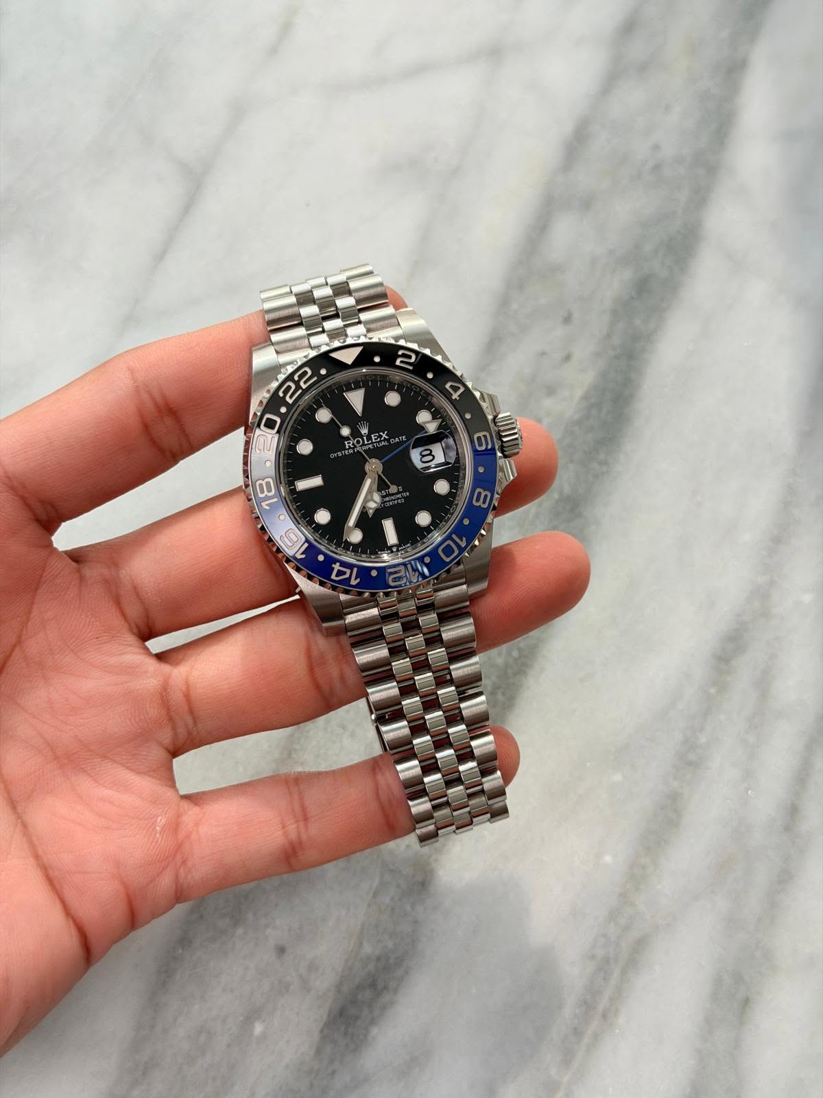 May be an image of wrist watch and text