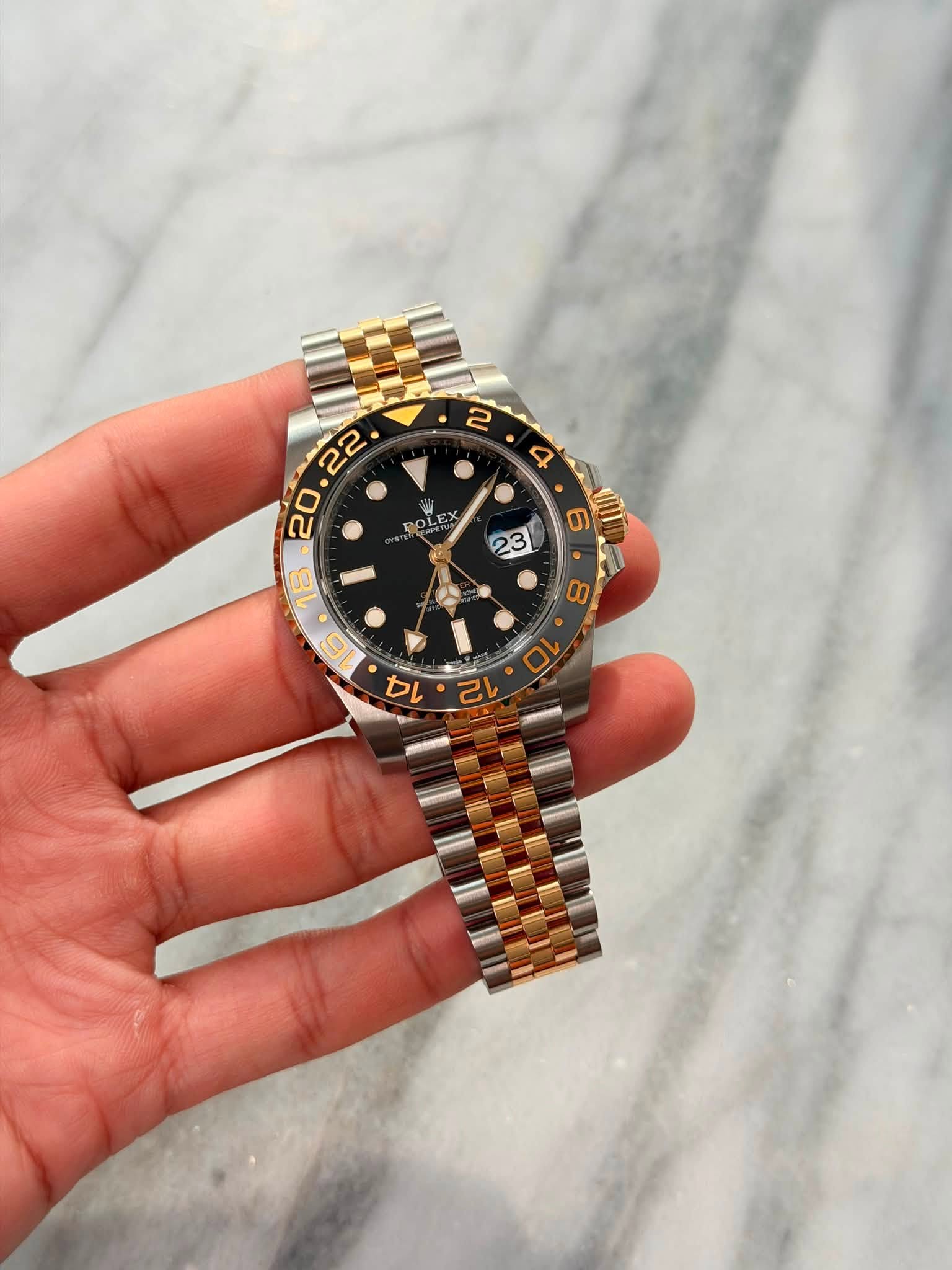 May be an image of wrist watch and text