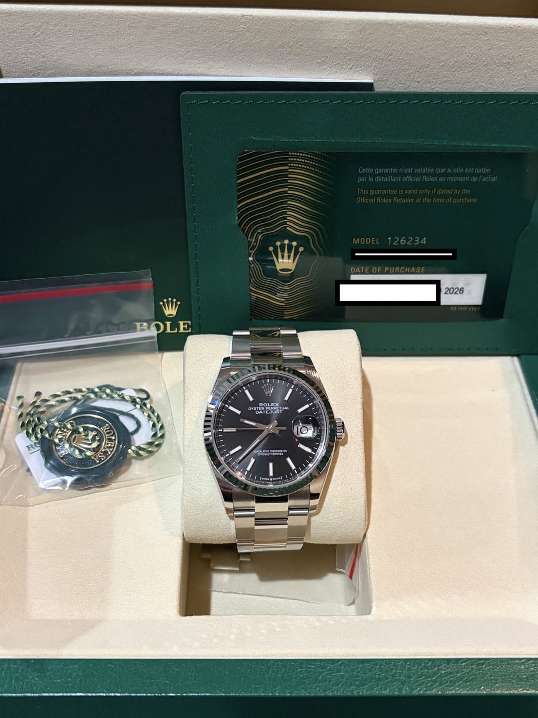 May be an image of wrist watch and text