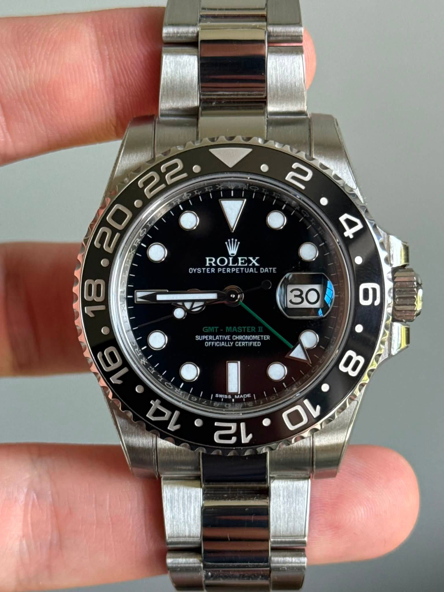 May be an image of wrist watch and text