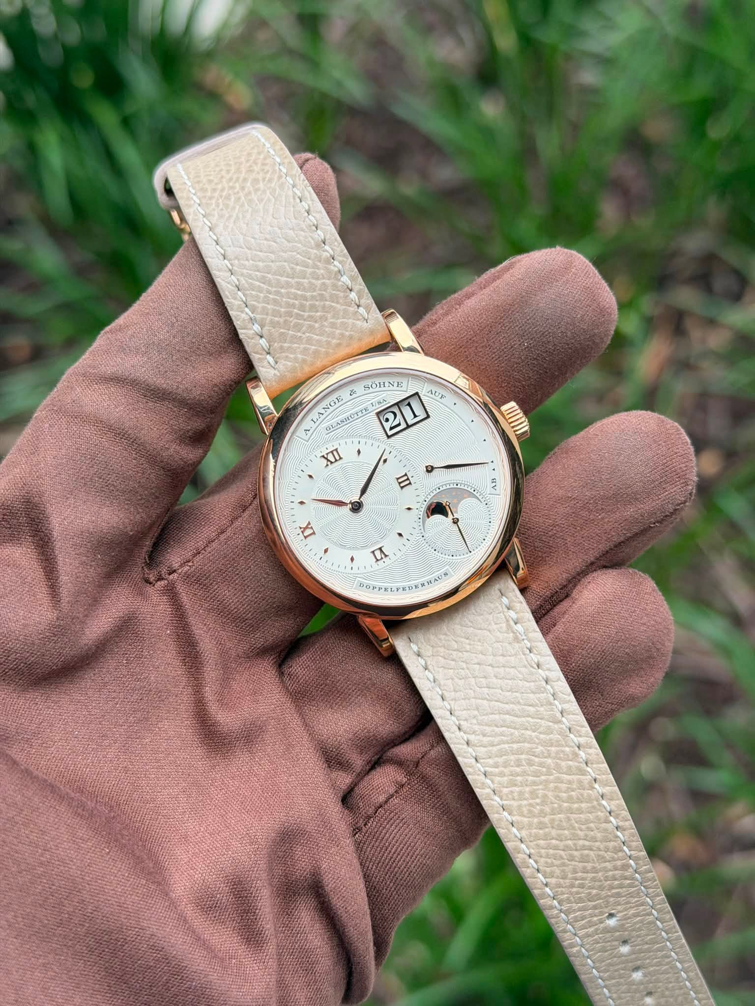 May be an image of digital watch, leather and text