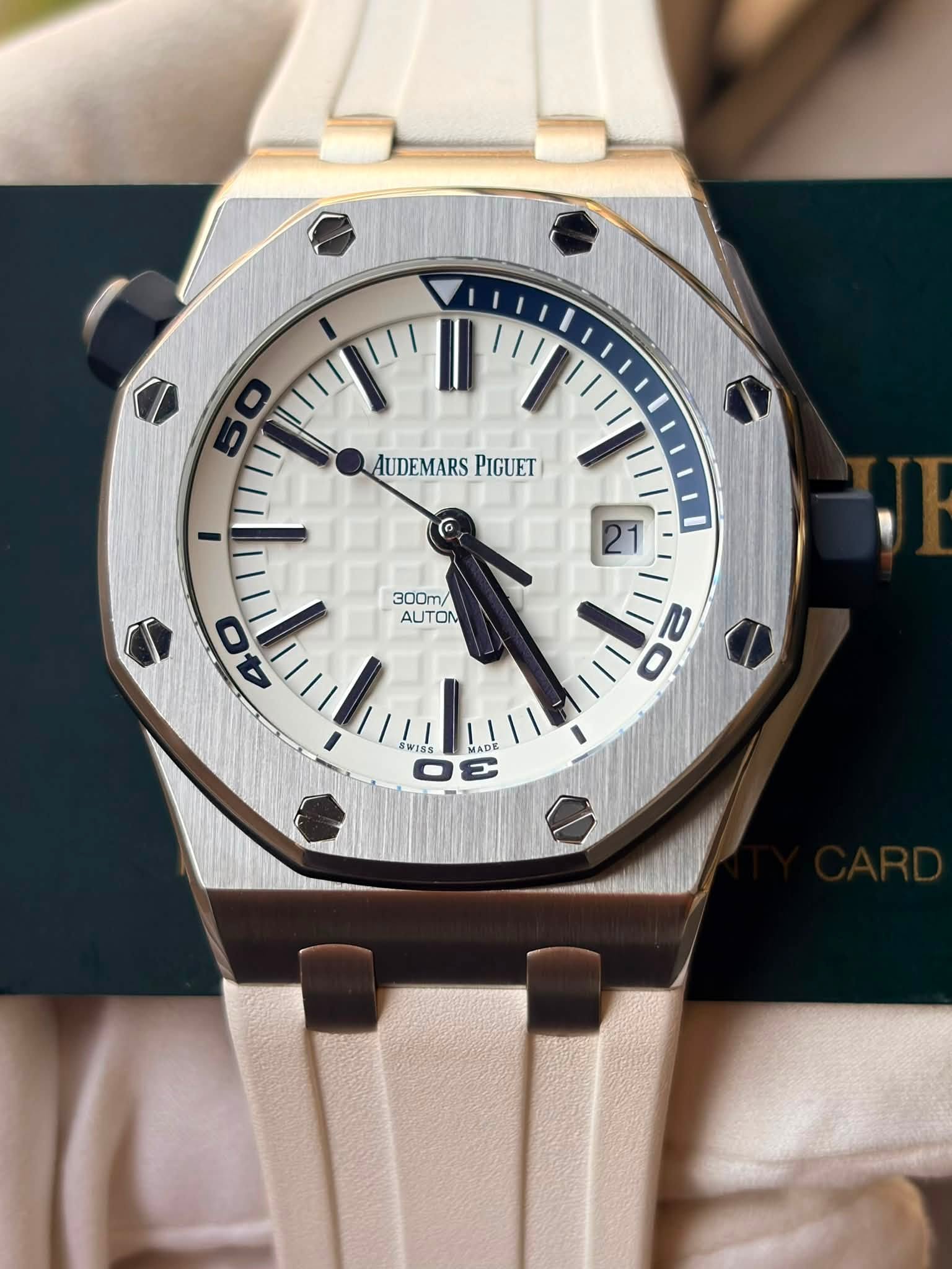 May be an image of wrist watch and text that says '50 AUDEMARSPIGUE AUDEMARS PIGUET I 21 300M/ AUTON 40 WISs 22 ADE ='