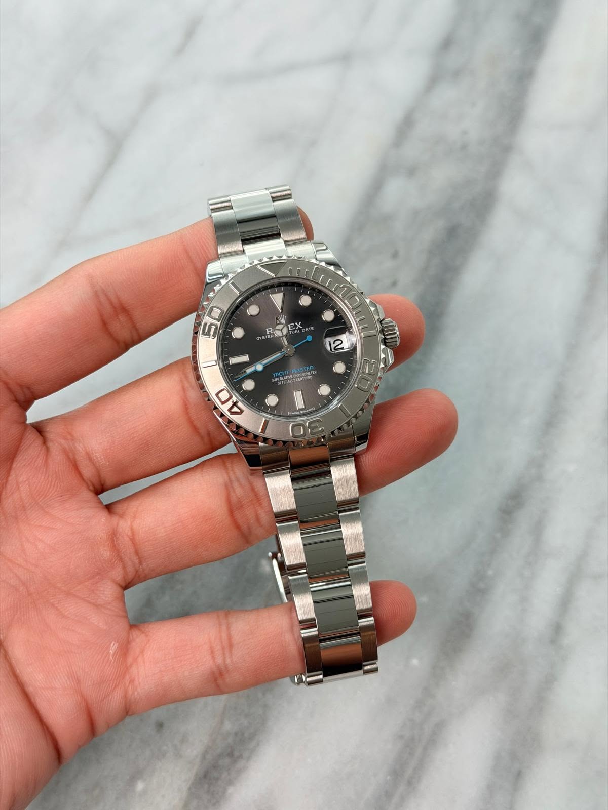 May be an image of wrist watch and text