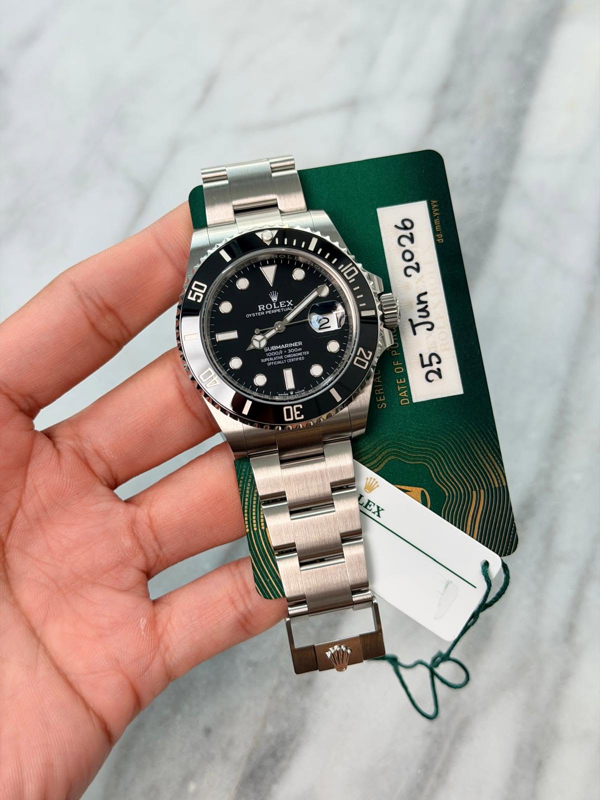 May be an image of wrist watch and text that says '50 10 ROLEX NPEFFET 2 JOMARINER AD 2202 uns ςτ AET 20 7 EX ወራቲ.'