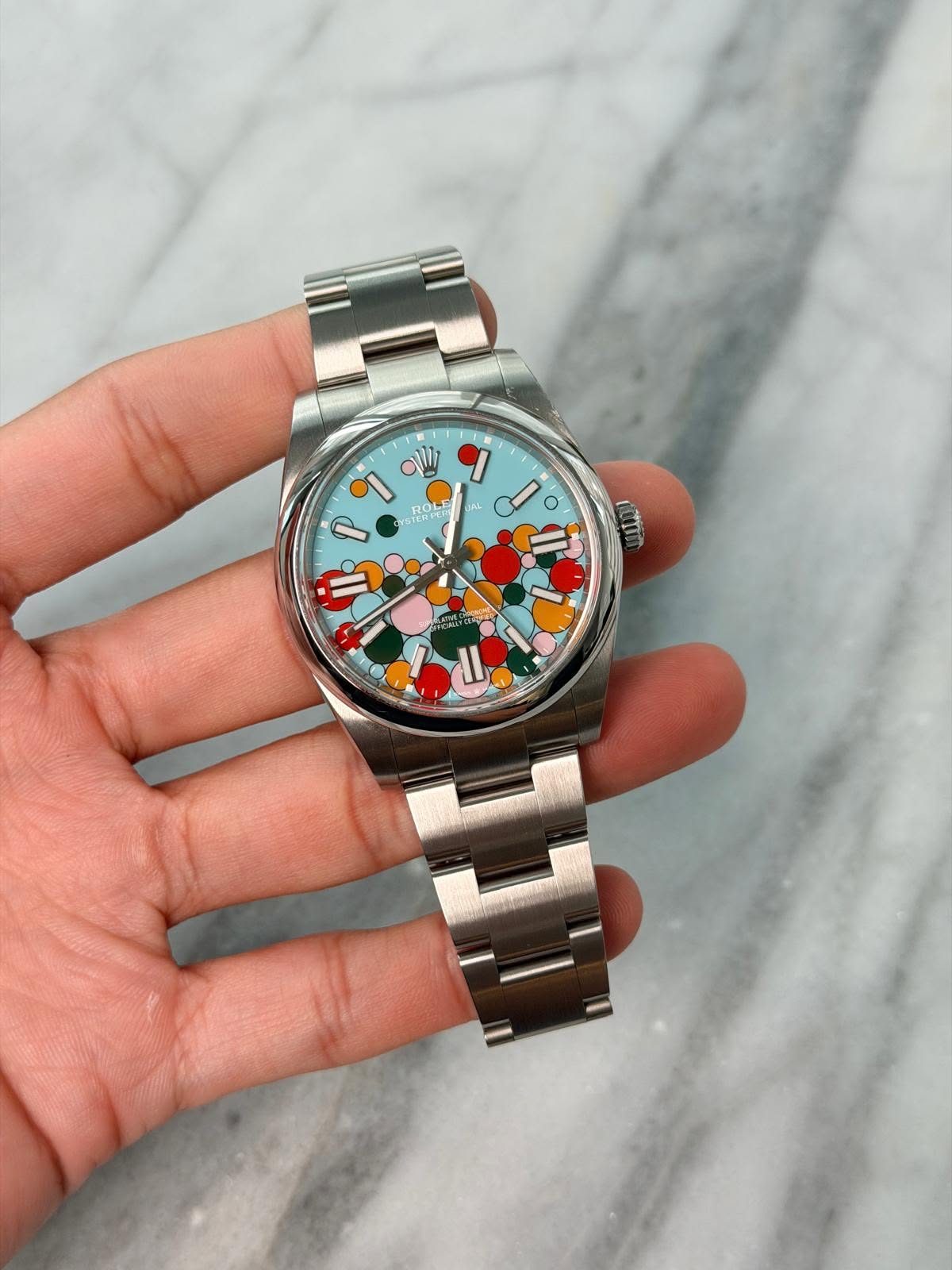 May be an image of wrist watch and text that says 'עי TERT 203 AL ل Ơ م tC / II'