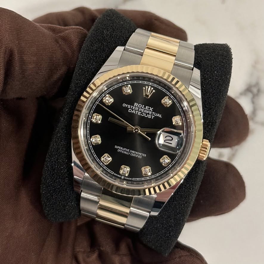 May be an image of wrist watch and text