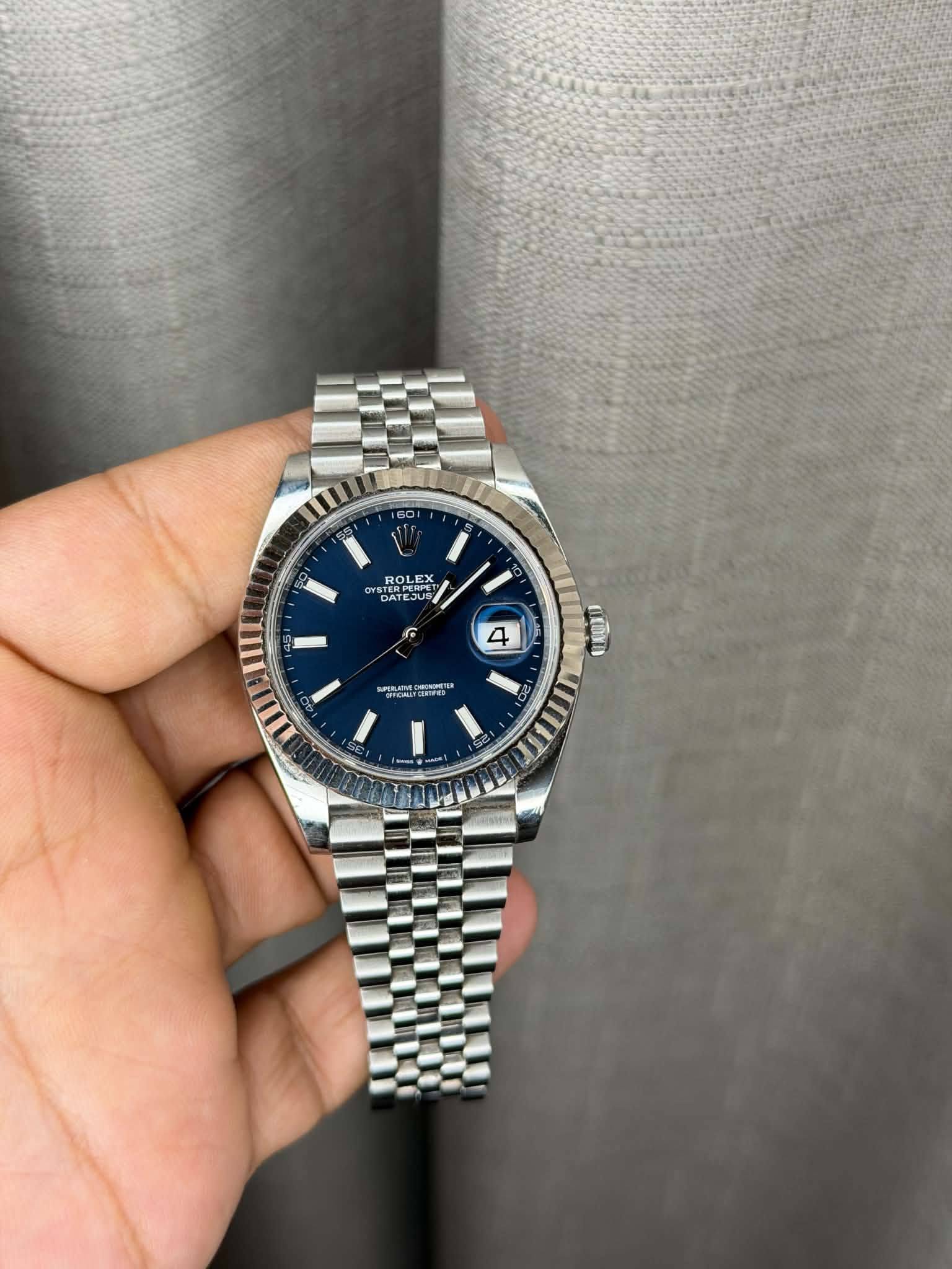 May be an image of wrist watch and text