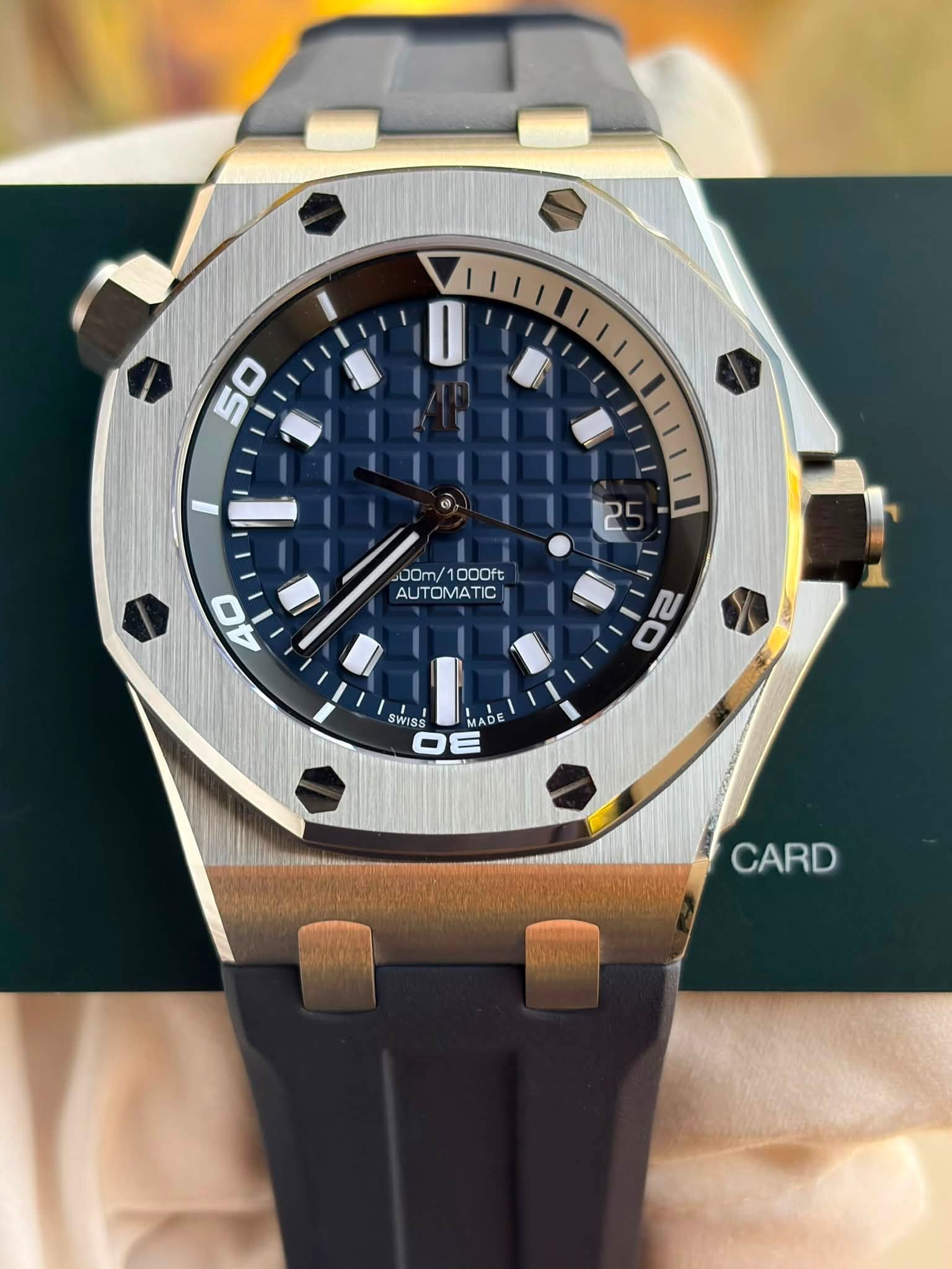 May be an image of wrist watch and text that says '50 5 25 00m/1000ft 00m/ 1000ft AUTOMATIC 40 っパ ป 20 SWISS MADE OE CARD'